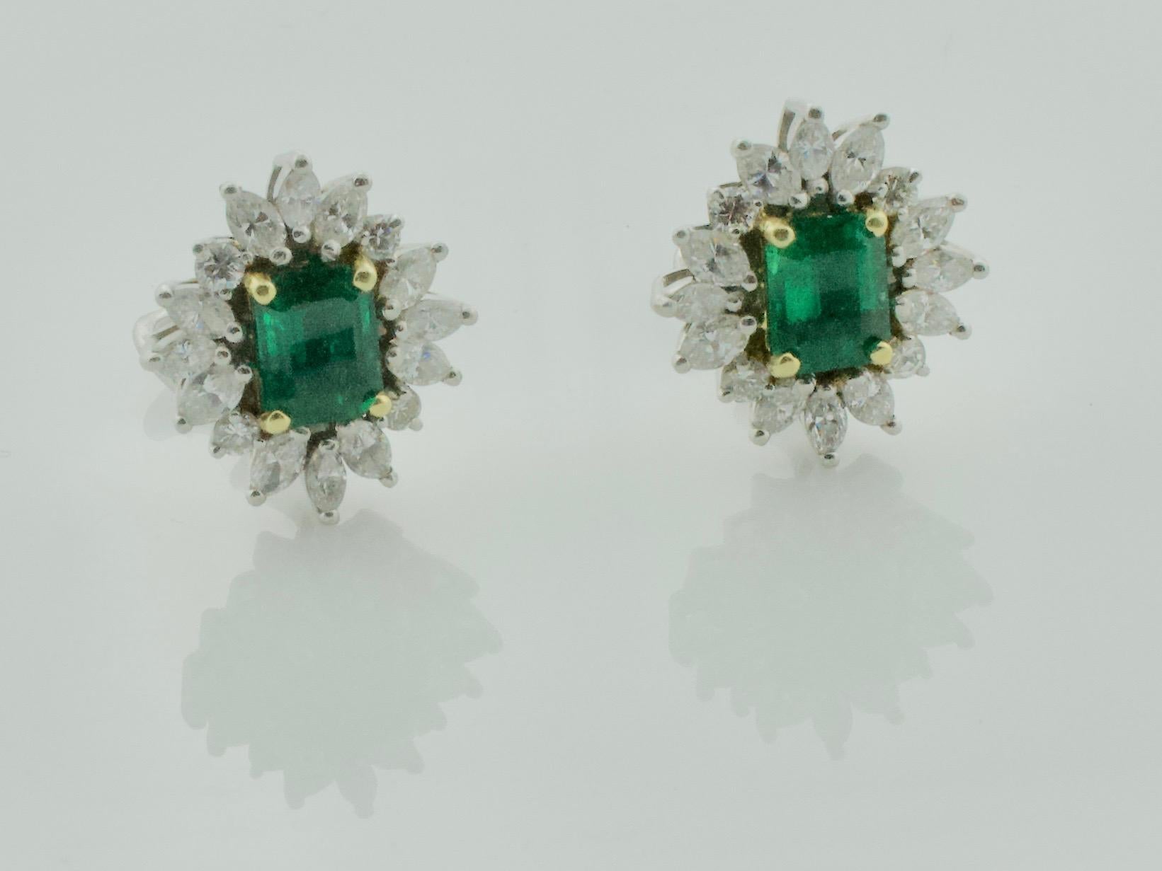 Emerald and Diamond Earrings with GIA Certification in Platinum
Classic Style and Wearability 
Two matched Emerald Cut Emeralds weighing 3.59 carats 
Twenty Four Marquise Cut Diamonds weighing 1.82 carats approximately
Eight Round Brilliant Cut