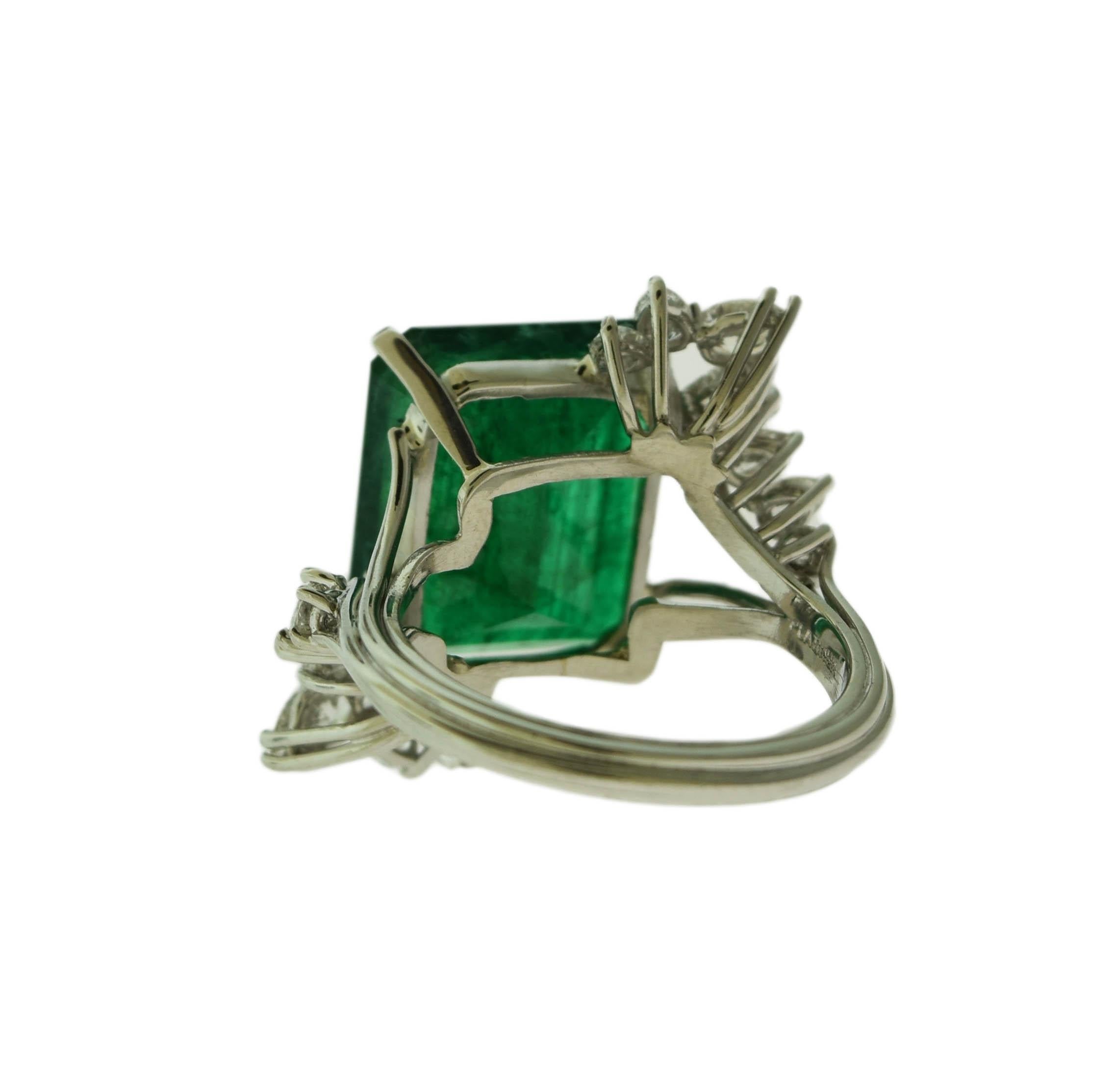 Style: Engagement/Cocktail Ring 

Material: Platinum

Ring size: 8

Metal Purity: 18K

Main Stone: Emerald

Main Stone size: 11 carats

Additional stones: Diamonds

Additional stones carats: 1.2 approx (in 18 stones)

Additional stones color: