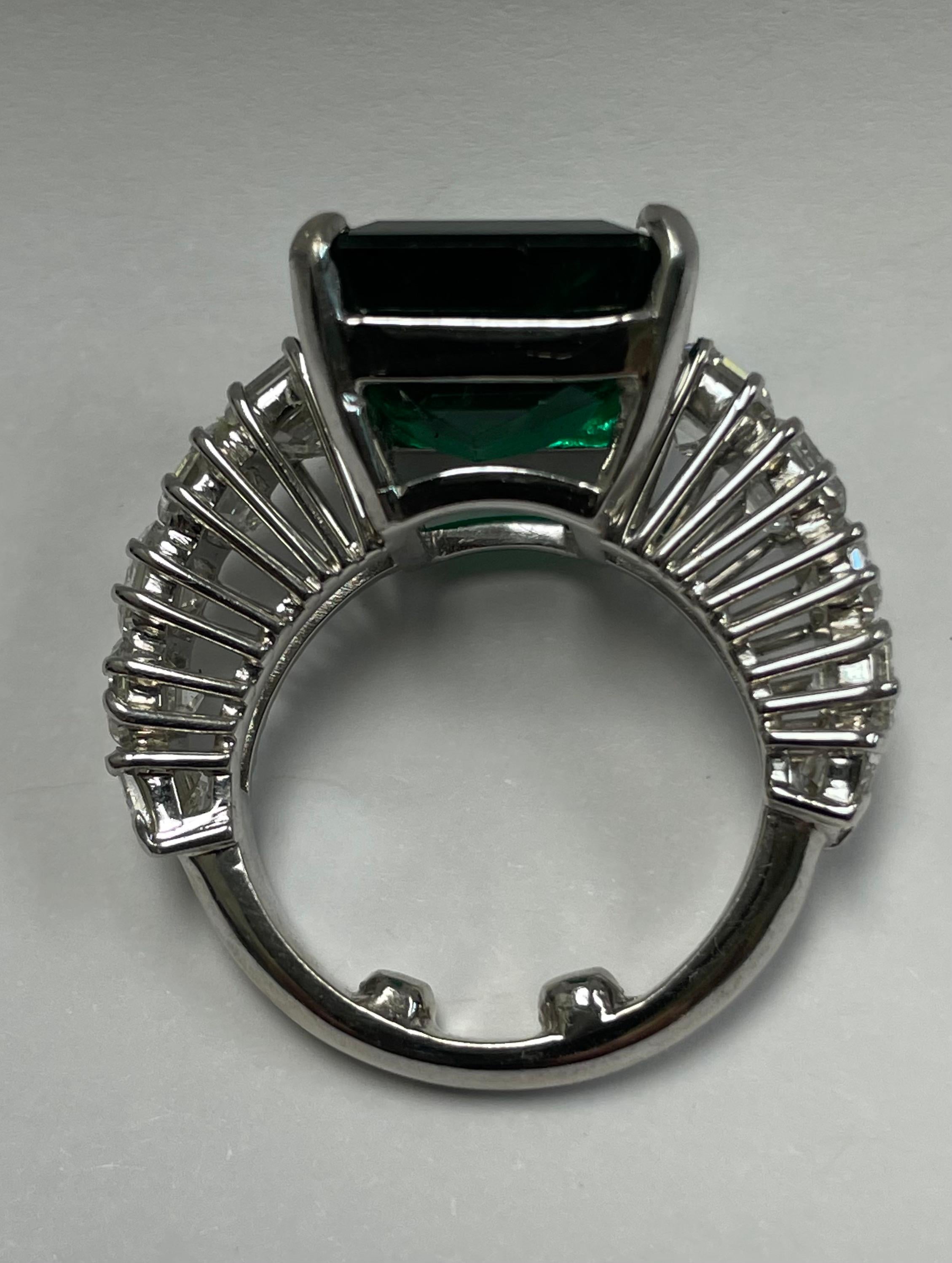 18K White gold Emerald and Diamond ring. The center stone in a natural Emerald, weight 9.74 carat with a Gemological report from the GIA. On the side the ring is set with 10 emerald cut Diamonds, total weight 5.30 carats, F color VS clarity.