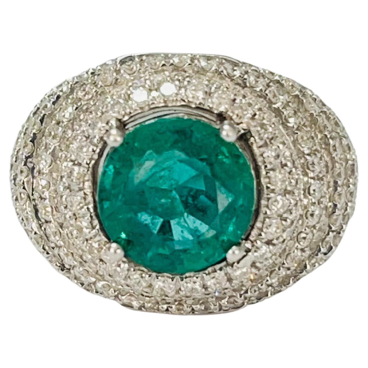 Gorgeous green Emerald and diamond engagement ring in 18k white gold. 
The details are as follows : 
Emerald weight : 3.20 carat 
Diamond weight : 1.95 carat ( GH color and VS clarity ) 
Emerald measurements : 9.3mm 
Ring head measurements : Height