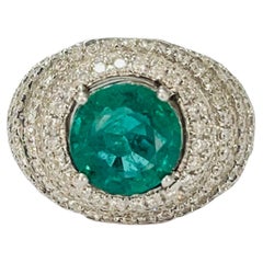 Emerald And Diamond Engagement Ring In 18K White Gold.