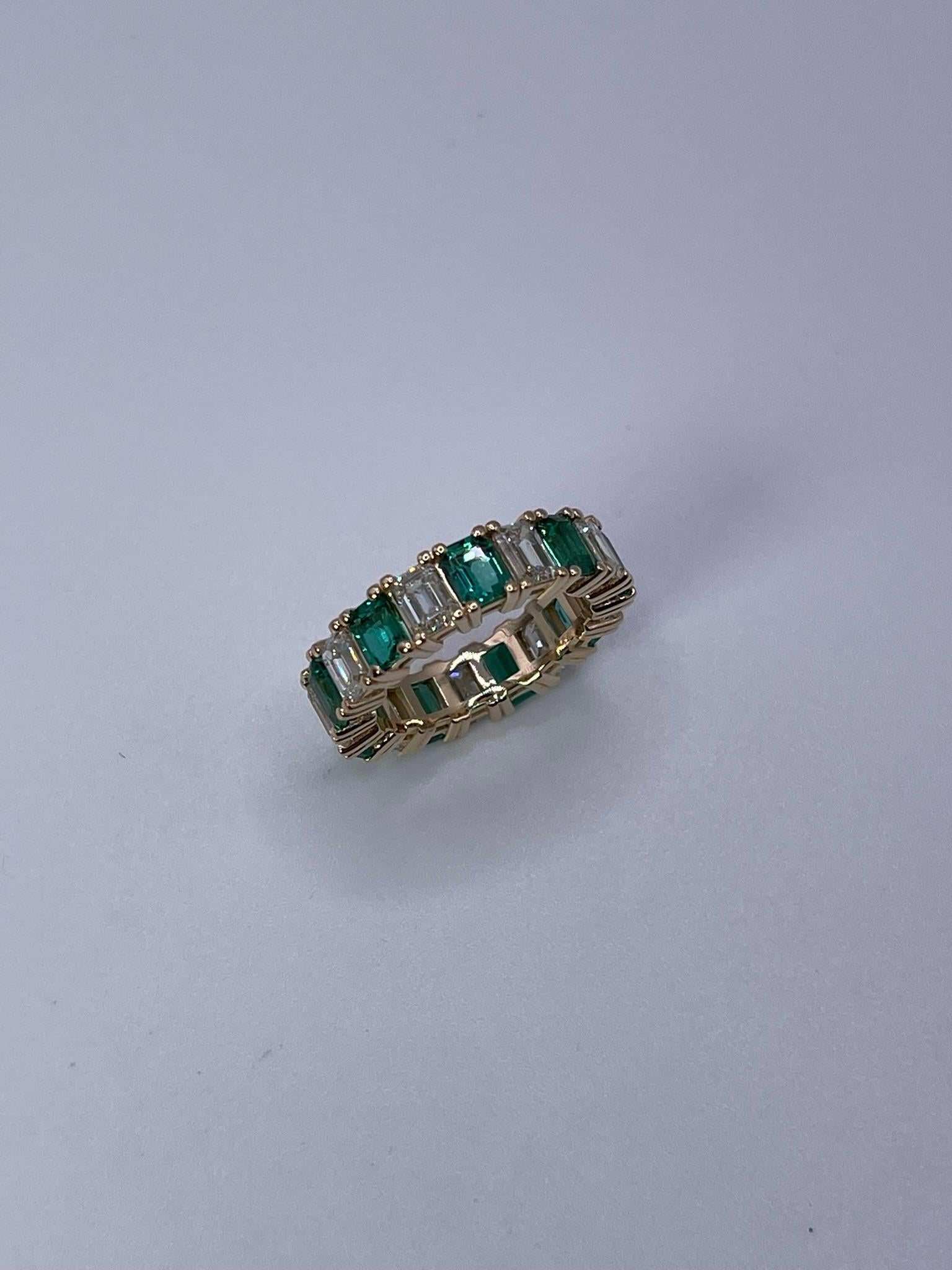 Emerald Cut Emerald and Diamond eternity ring 18KT gold For Sale