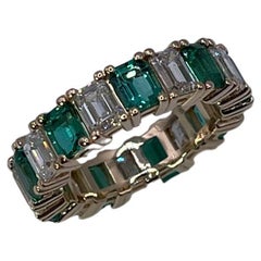 Emerald and Diamond eternity ring 18KT gold