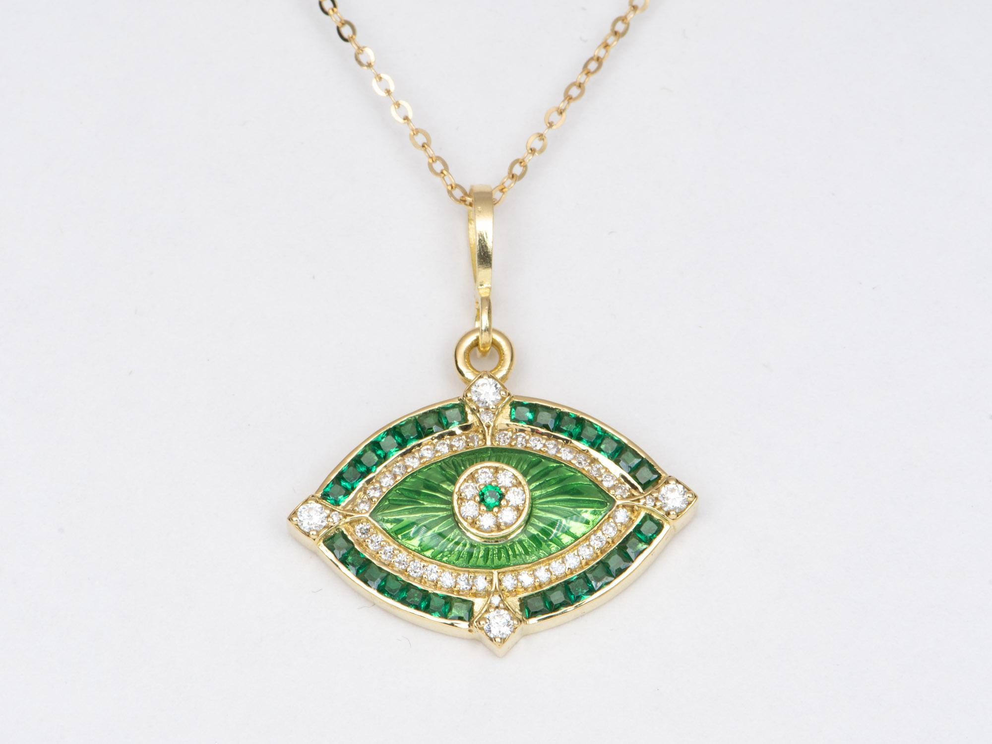 ♥ A solid 18K gold evil eye pendant featuring gorgeous princess-cut emeralds and diamonds
♥ This pendant features an inner halo of guilloche enamel
♥ The pendant measures 20mm in length, 24.2mm in width, and 4.8
♥ Material: 18K Gold

♥♥ Guilloche,