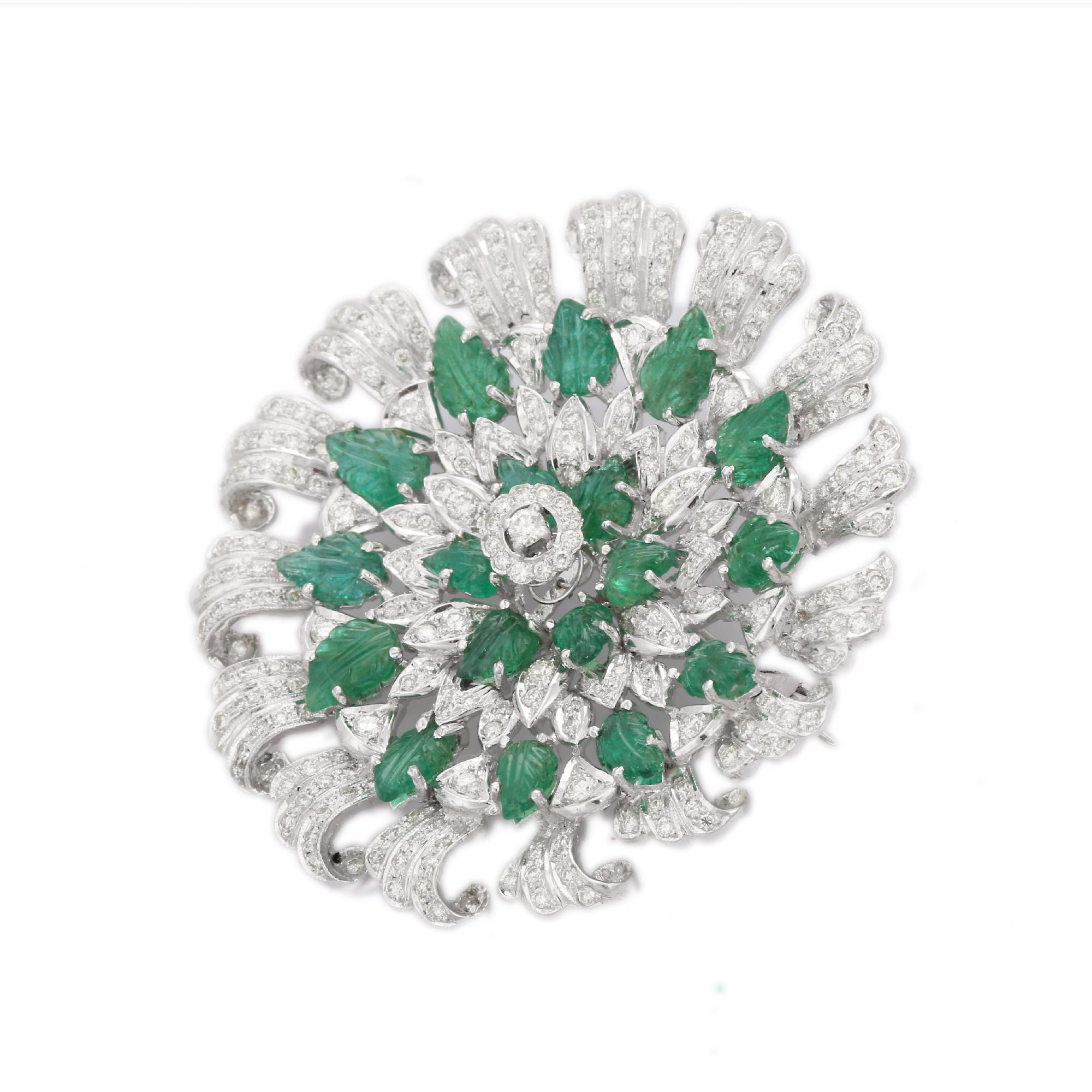 Carved Emerald Diamond Big Flower Brooch Made in 18K Gold which is a fusion of surrealism and pop-art, designed to make a bold statement. Crafted with love and attention to detail, this features 11.32 carats of emerald which makes you stand out of