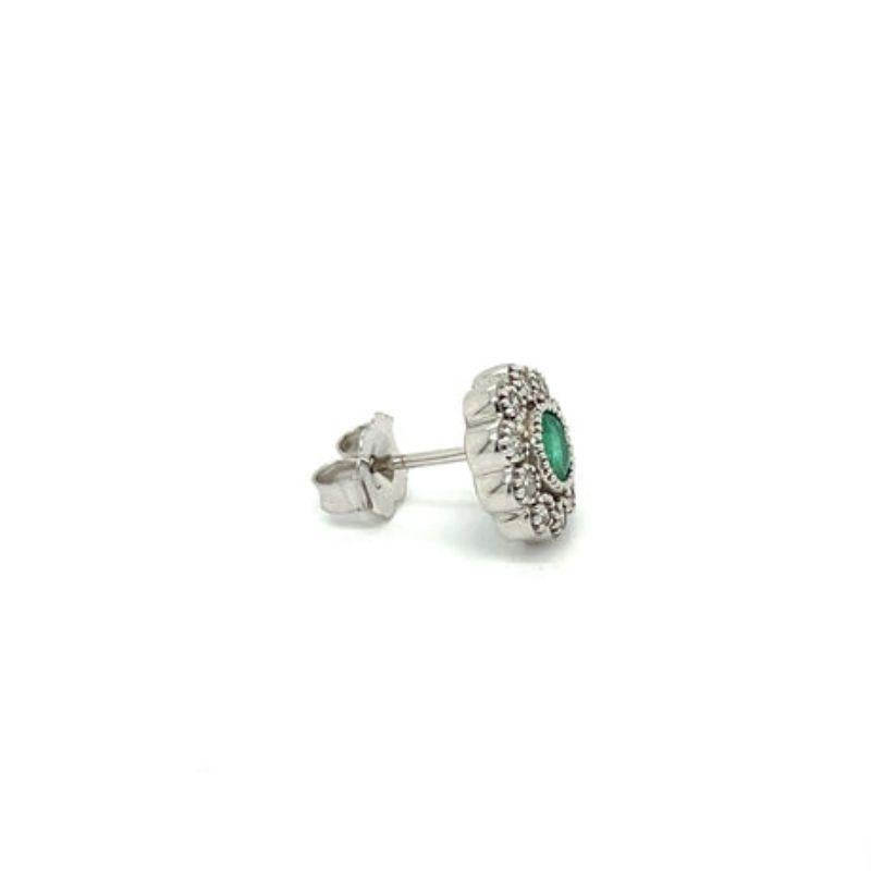 These stunning emerald and diamond flower earrings will bring a classic vintage charm to any outfit. Expertly crafted with shimmering diamonds and vibrant emeralds, they offer an exquisite and timeless look perfect for any special