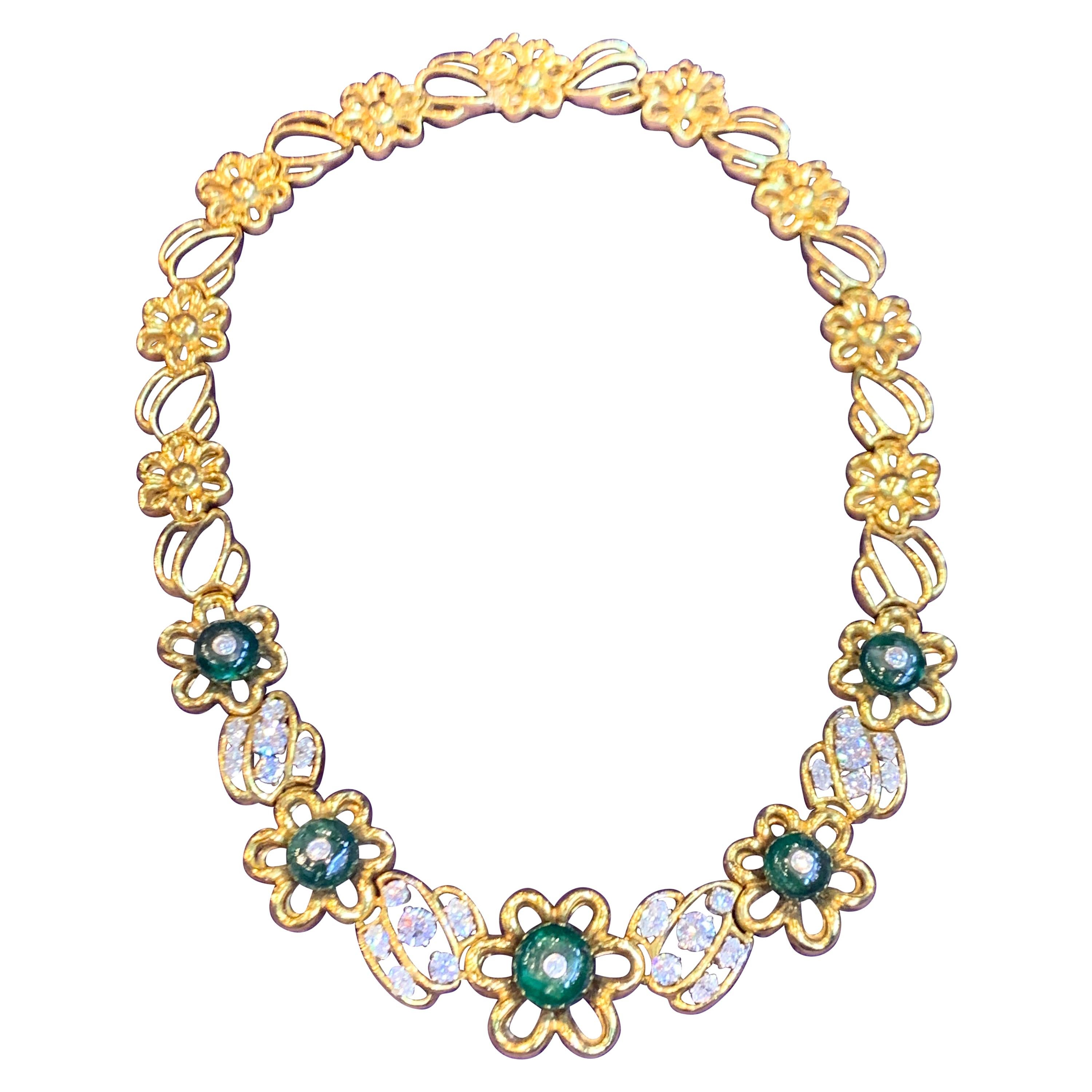 Collier à maillons en forme de fleur avec émeraudes et diamants