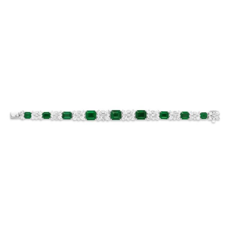 EMERALD AND DIAMOND GARDEN BRACELET A cornucopia of textures and shapes, this unique diamond and emerald bracelet combines classic styling with unexpected intrigue. A hand made piece in Platinum Item: # 03414 Metal: Platin;18k Lab: Gia And