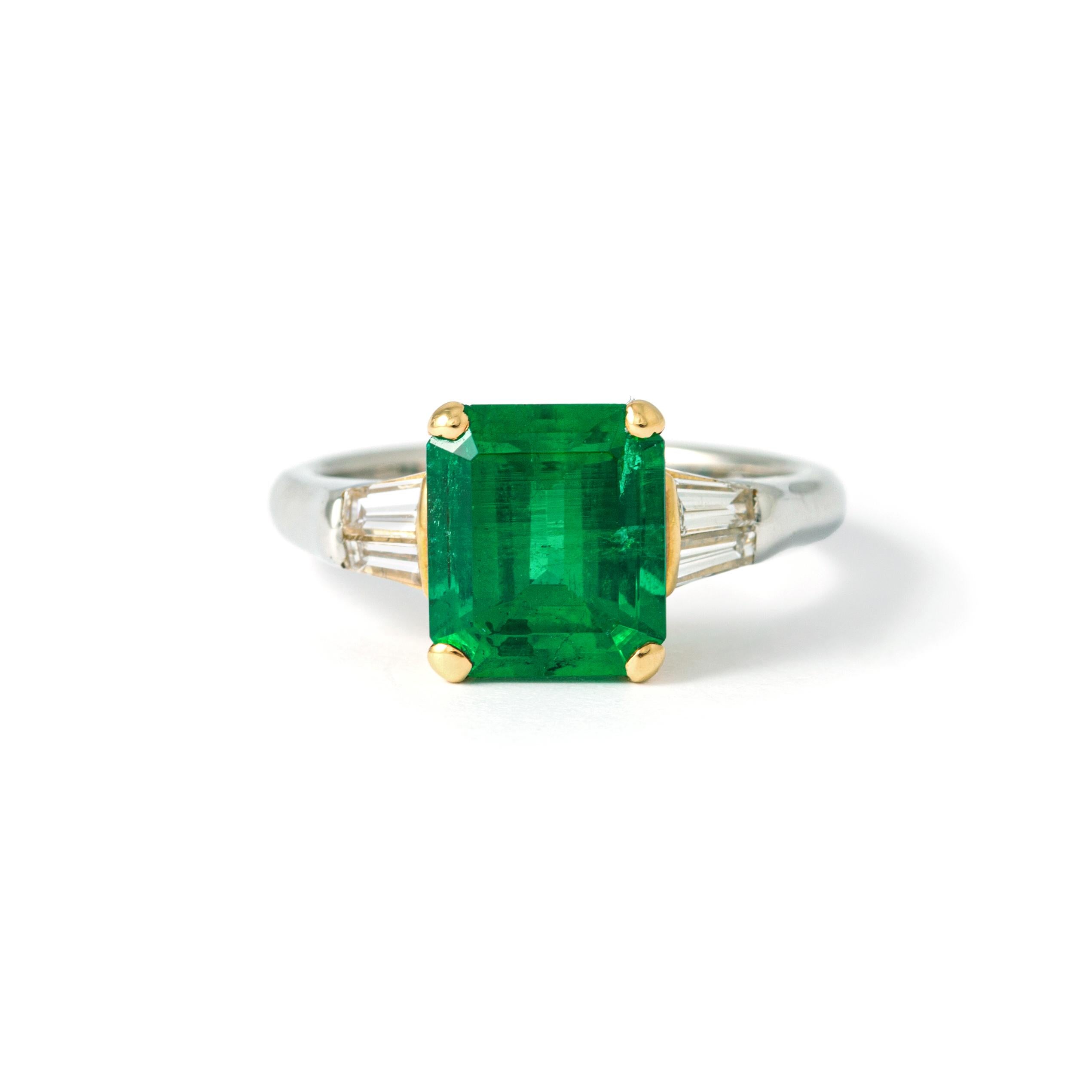 Ring in 18kt yellow and white  gold set with one emerald cut emerald 2.80 cts and diamonds 0.45 cts Size 53        