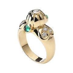 Anillo de oro con esmeralda y diamantes
