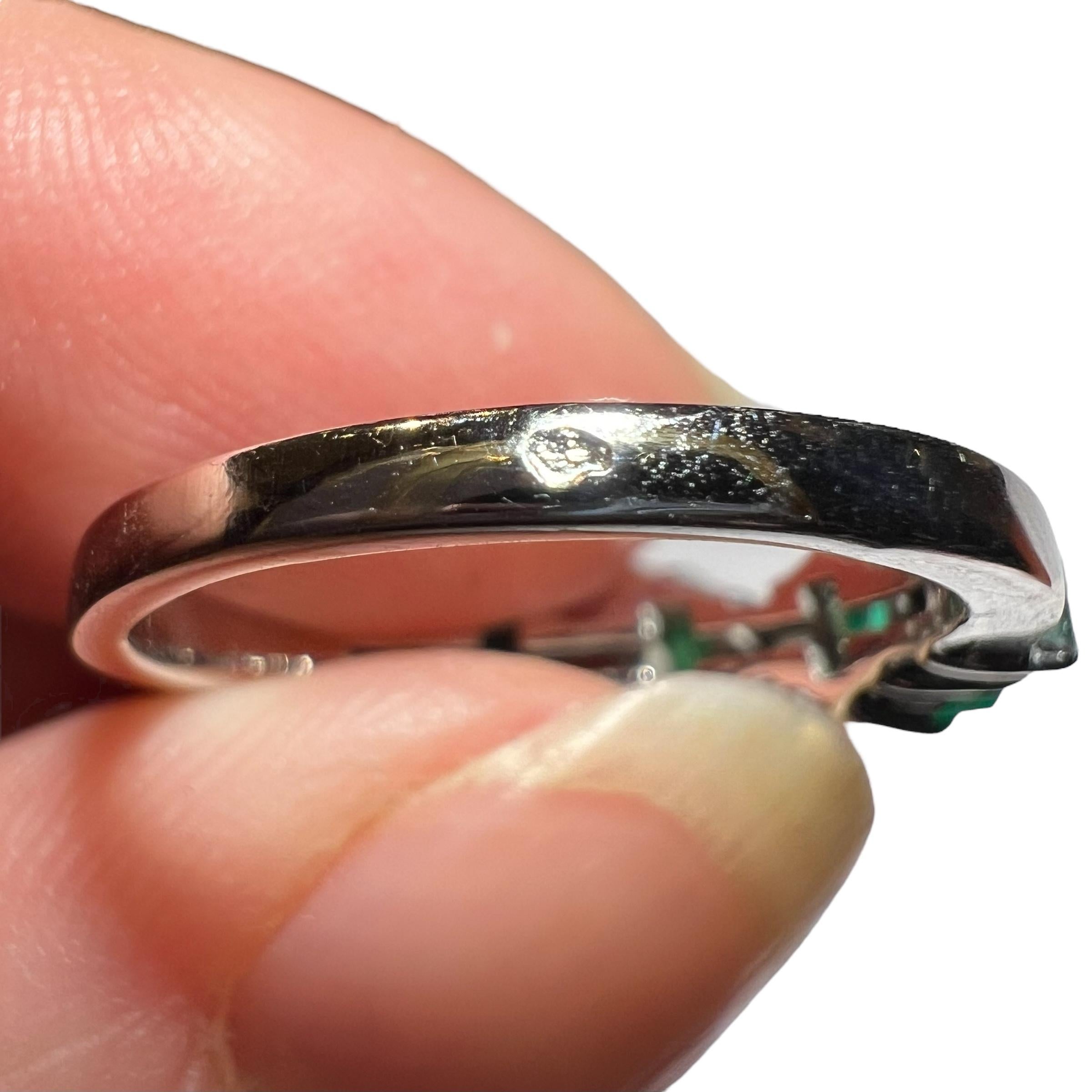Half wedding ring in 18 carat white gold, set with:
-4 baguette-cut diamonds, total weight approx. 0.50 carat
-3 Colombian emeralds, approx. 0.50 carat in all 
The quality of the emeralds is superb! Vivid bluish-green color typical of Colombian