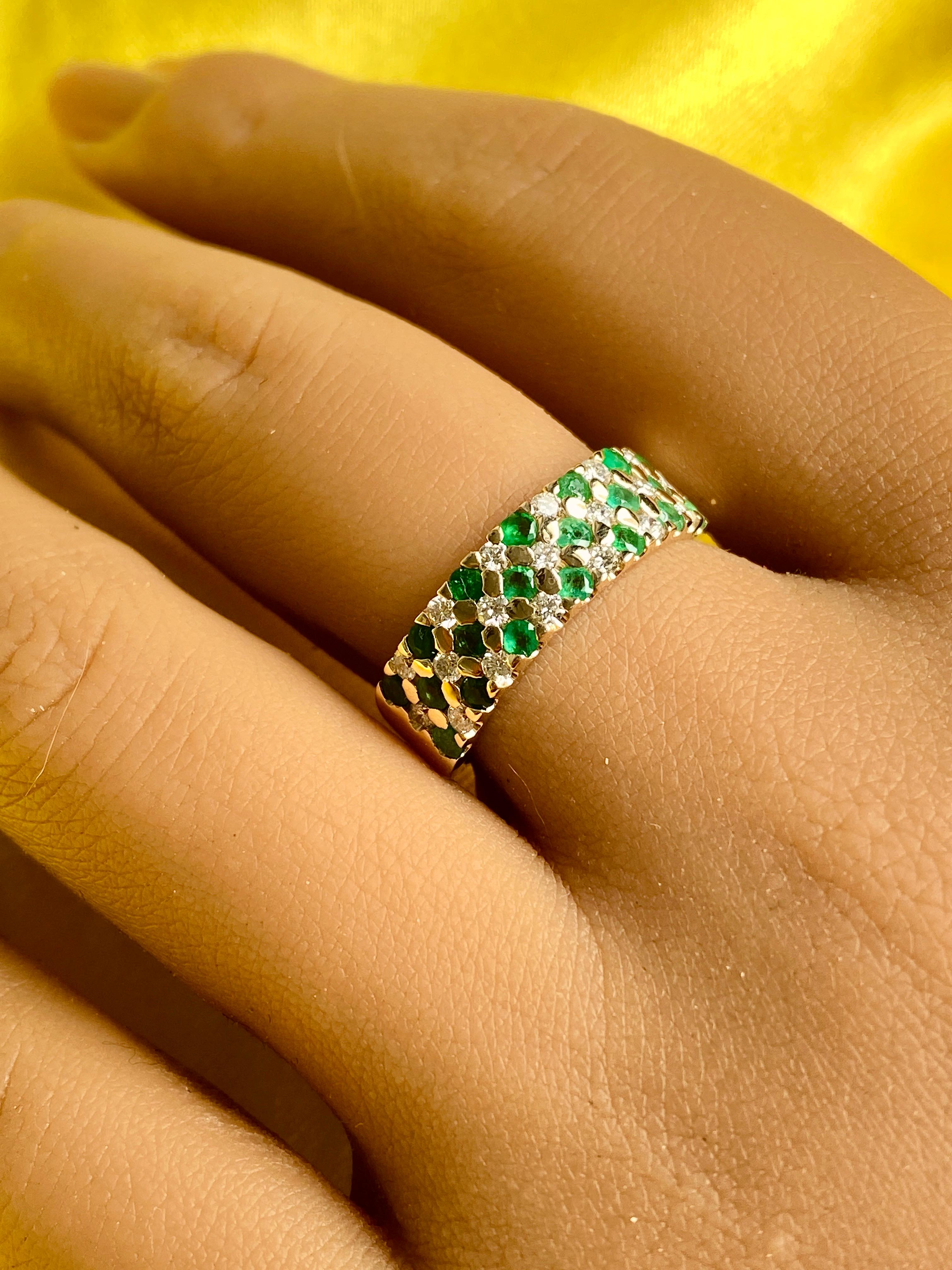 14k solid gold Emerald and Diamond band

This ring is crafted in 14k solid gold with Genuine Green Emeralds and VS quality Diamonds. The unique design and setting of this ring steals the show!
A perfect band to stack rings with, or can even be a