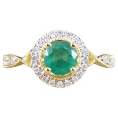 Emerald and Diamond Halo Cluster Ring and Diamond Shoulders in Yellow Gold