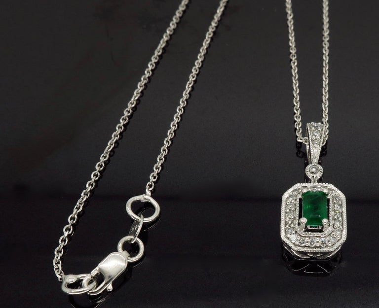 Emerald and Diamond Halo Pendant Necklace at 1stDibs
