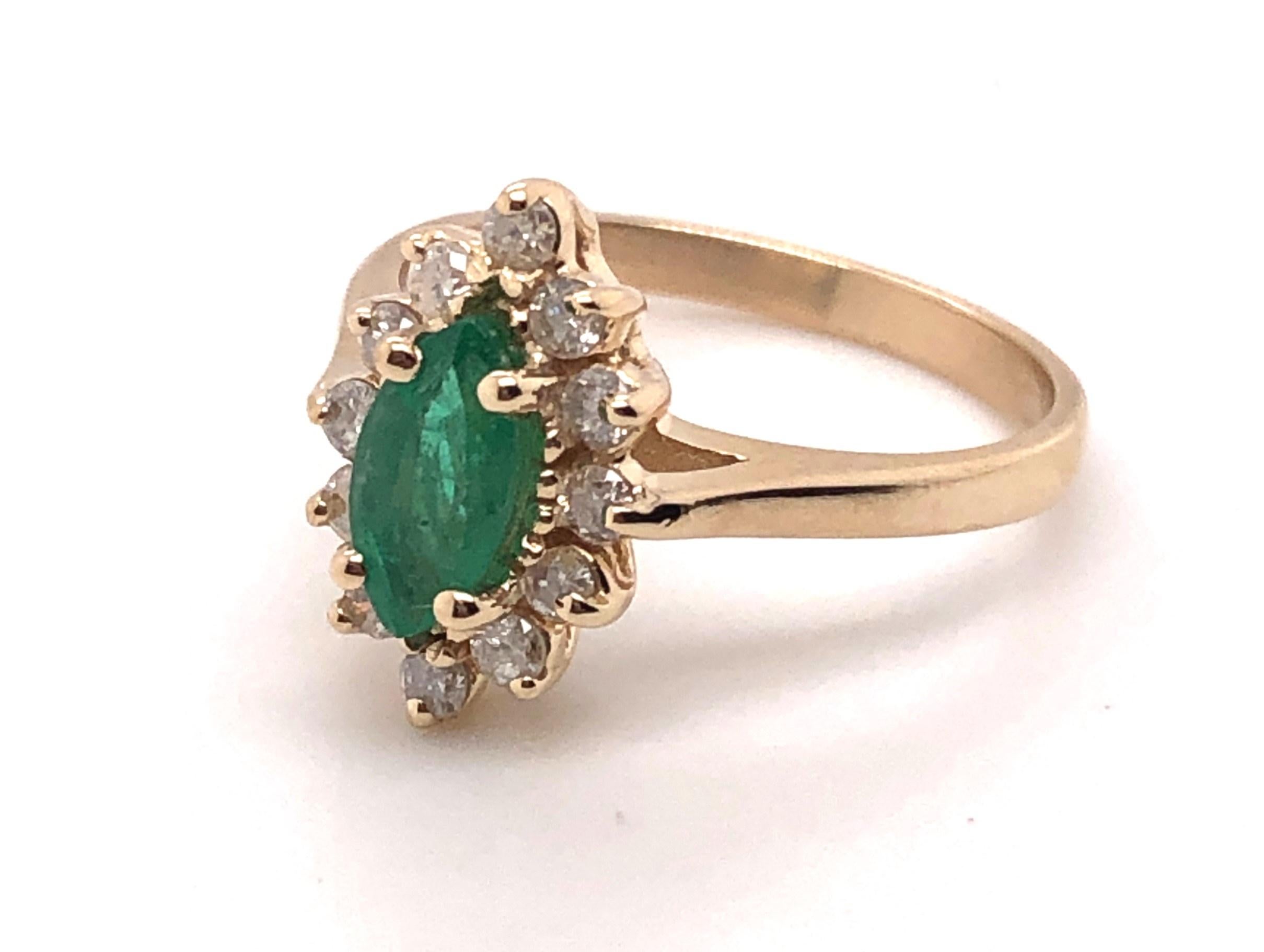 10kt  approximately .48ct marquise cut emerald and approximately .36tcw H-I color I1-I2 clarity diamond halo ring. 

This ring is a finger size 6.50 and can be adjusted. 

The ring measures 3/8 inch wide by 9/16 inch long.