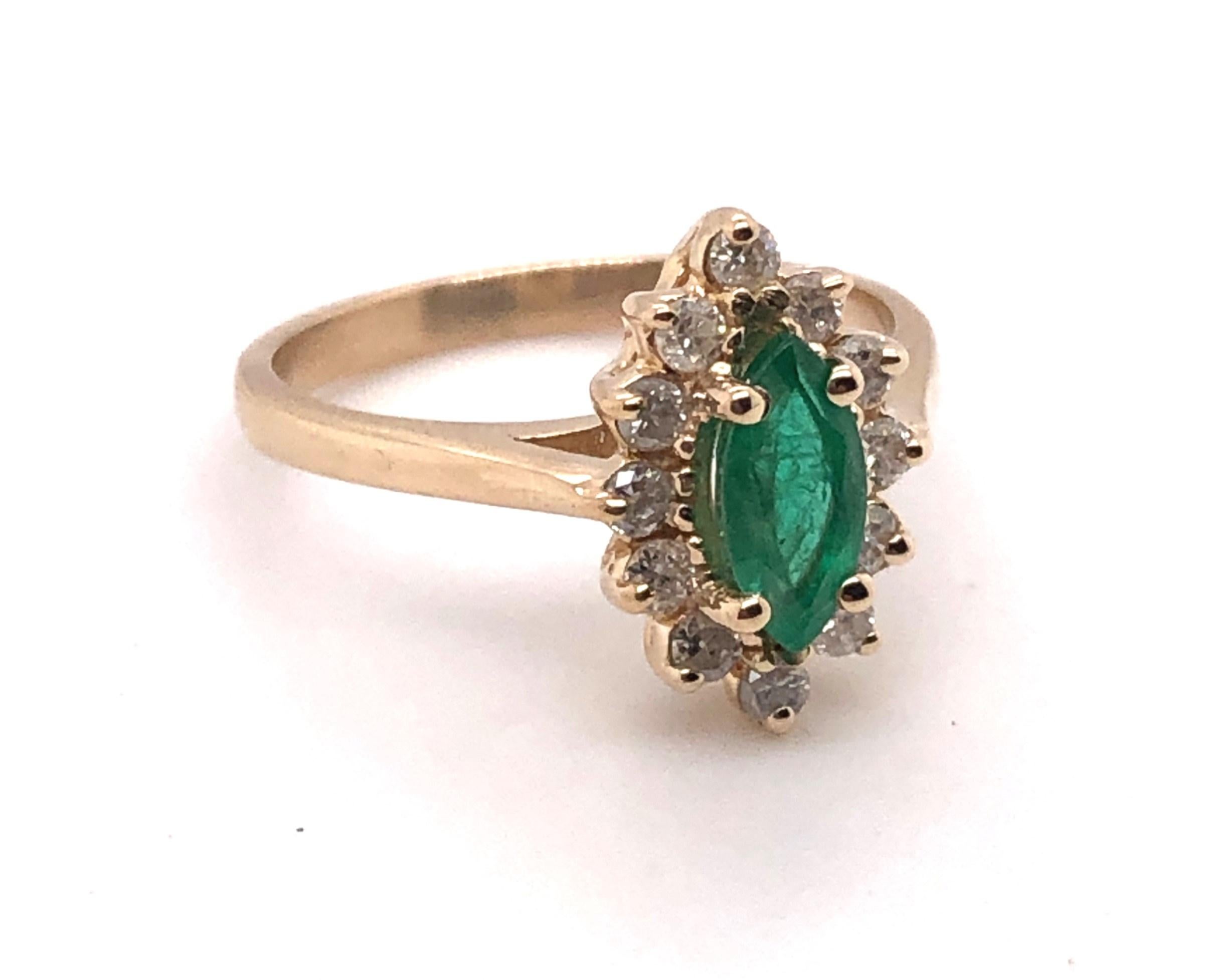 Marquise Cut Emerald and Diamond Halo Ring