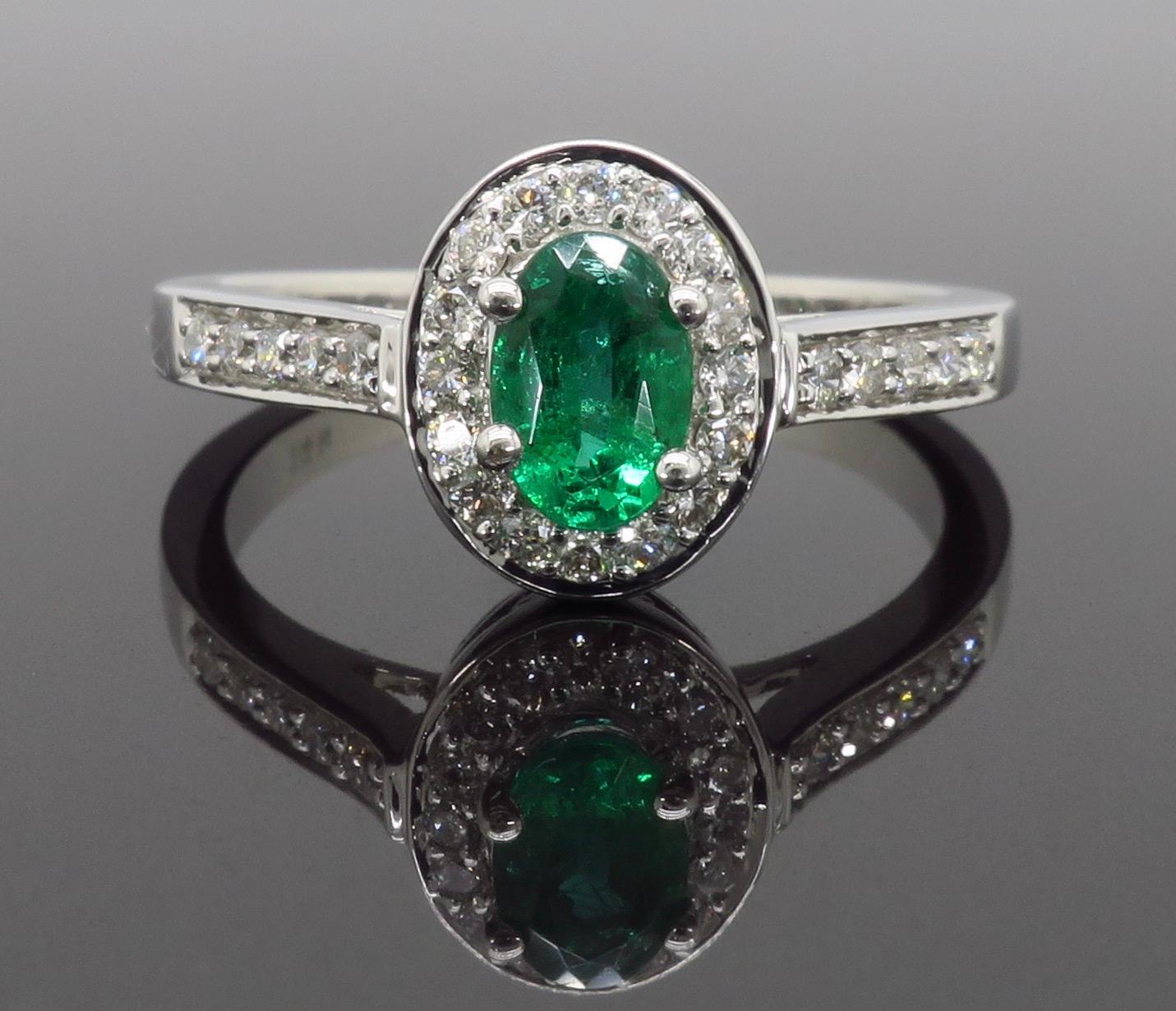 Oval Cut Emerald and Diamond Halo Ring