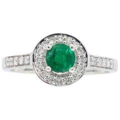 Halo-Ring mit Smaragd und Diamant