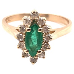 Vintage Emerald and Diamond Halo Ring