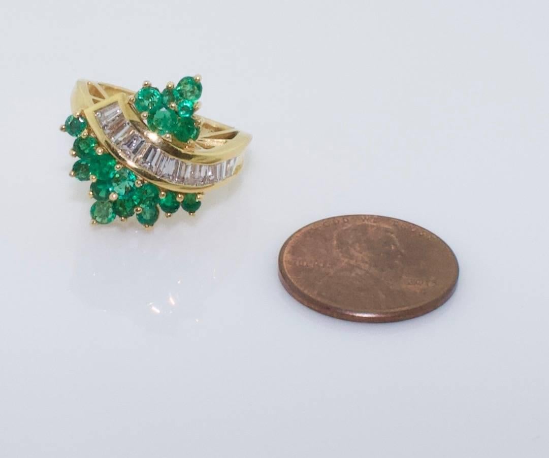 Emerald and Diamond in 18k Yellow Gold Ring
Eighteen Round Emeralds weighing 1.53 carats (Great Color and Clarity)
Nine Tapered  Diamonds weighing 1.02 carats (GH VVS)
Designed by The Late Great Bill Bates for Terrell and Zimmelman in the 1970's 
