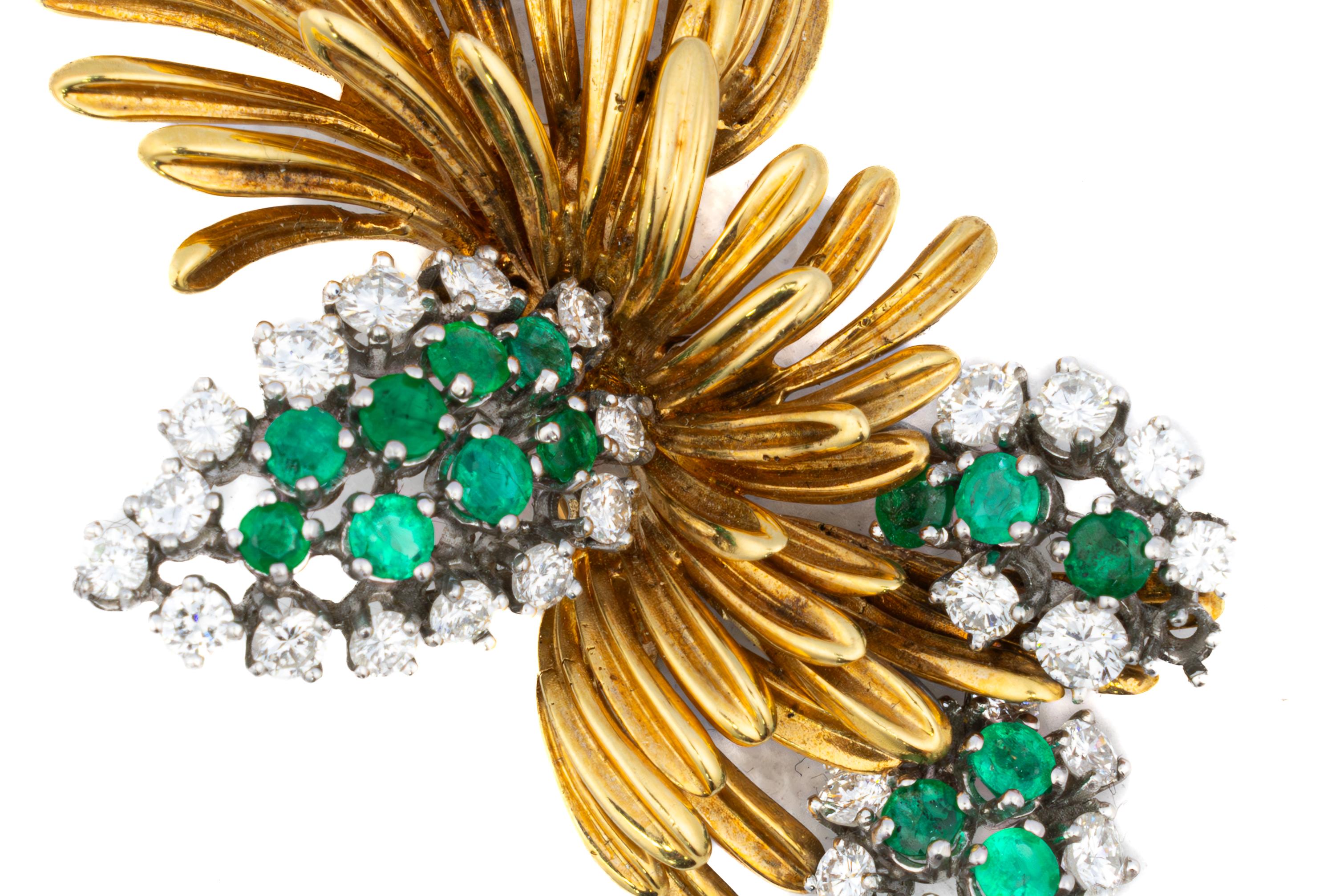 Emerald and Diamond Leaf Brooch

Description:
This sculptural mid-century brooch is designed as a stylized botanical spray, crafted in richly textured 18K yellow gold. Clusters of vivid green round-cut emeralds are nestled among sprays of sparkling