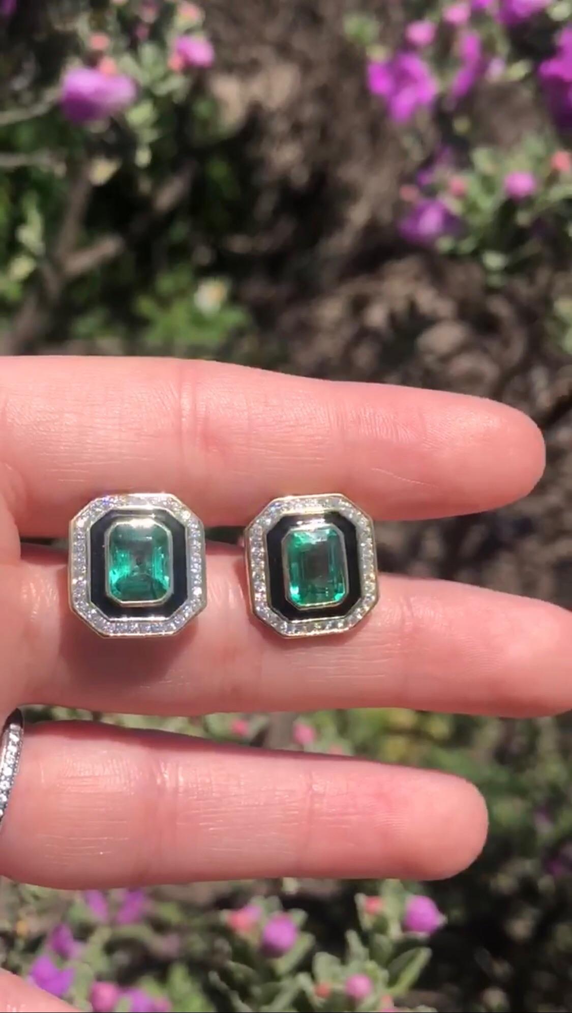 3.10 carats of vivid, bright Emerald cut Emeralds set in Black Enamel. The Emeralds and Black Enamel are surrounded by a border of .55 carats of G/H VSI Diamonds which really make them stand out on the ear. A great alternative to plain studs that