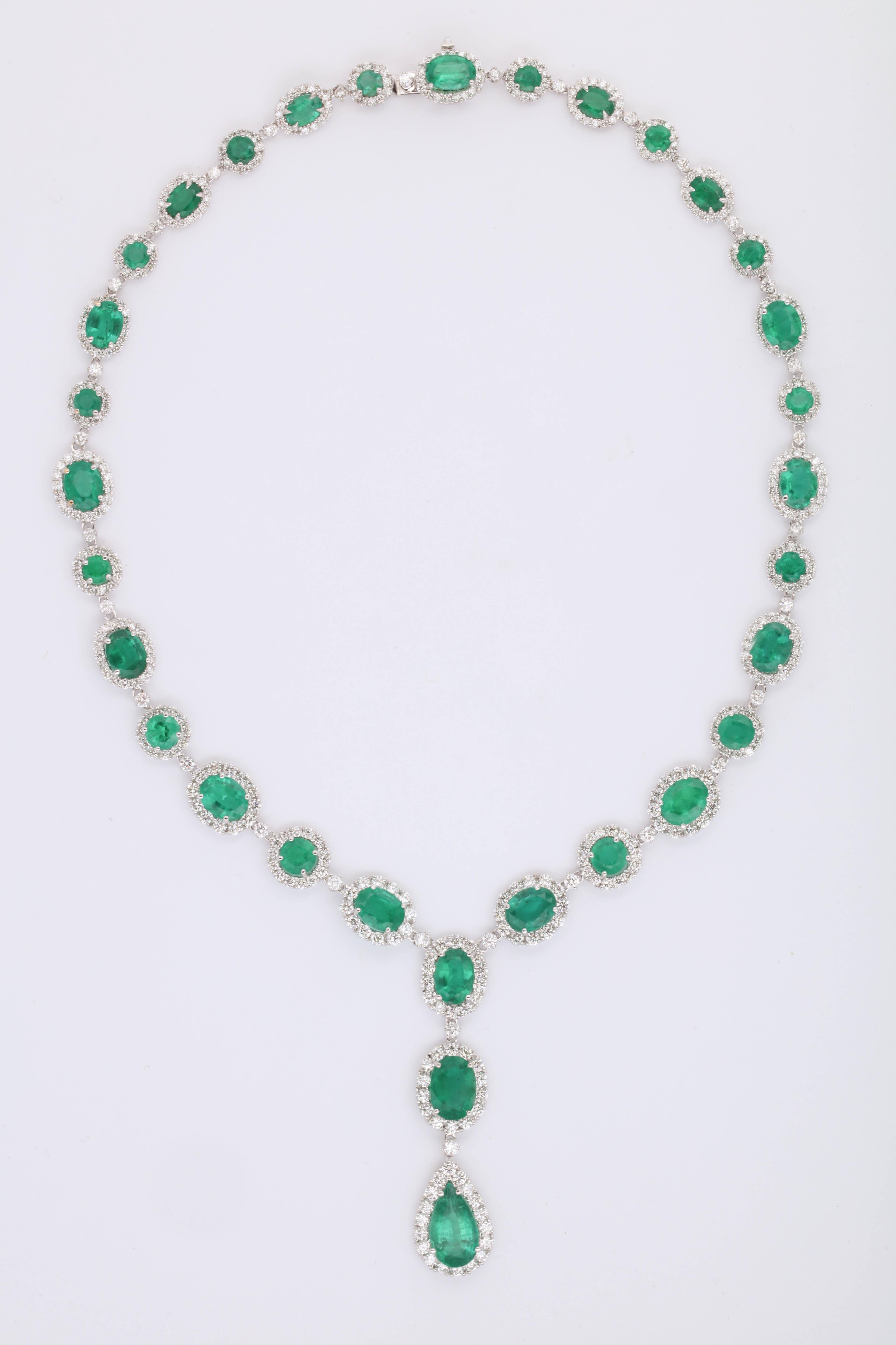 
A classic and elegant Green Emerald and diamond necklace featuring round, oval and pear shape green emeralds. 

41.75 carats of fine green emerald.

15.14 carats of white, round brilliant cut diamonds.

18k white gold 

17 inch length with just