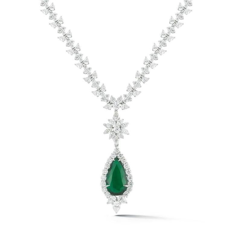 EMERALD AND DIAMOND NECKLACE A beautifully refined 13 ct Emerald dangles from a snowflake inspired pattern of polished white diamonds Item: # 02730 Metal: Platinum Lab: Gia Color Weight: 13.82 ct. Diamond Weight: 31.56 ct.



