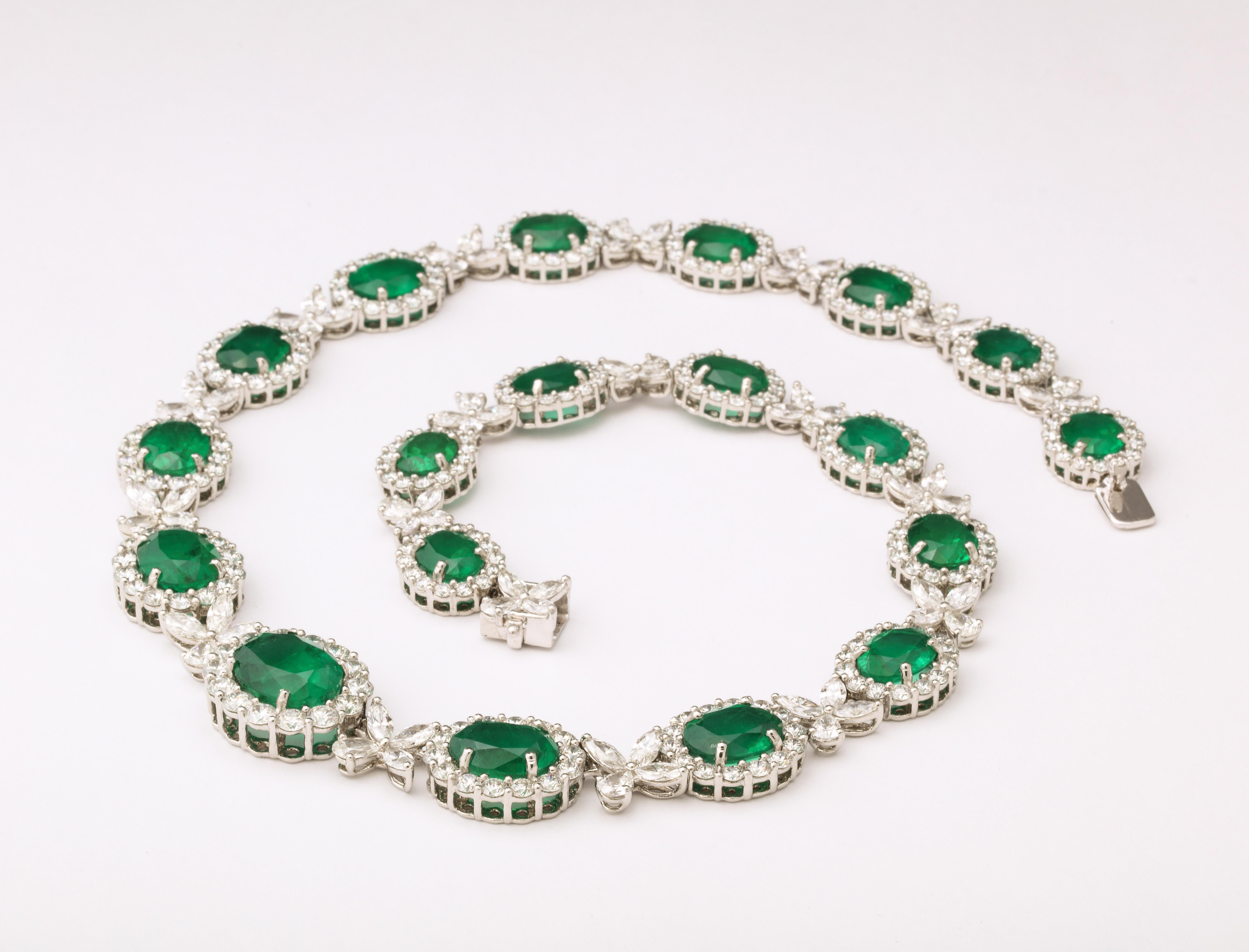 
A timeless design!

61.85 carats of Fine certified VIVID GREEN Oval Emeralds 

37.91 carats of white round brilliant, pear and marquise cut diamonds. 

Set in platinum. 

17.5 inch length. 

Certified by Christian Dunaigre of Switzerland,