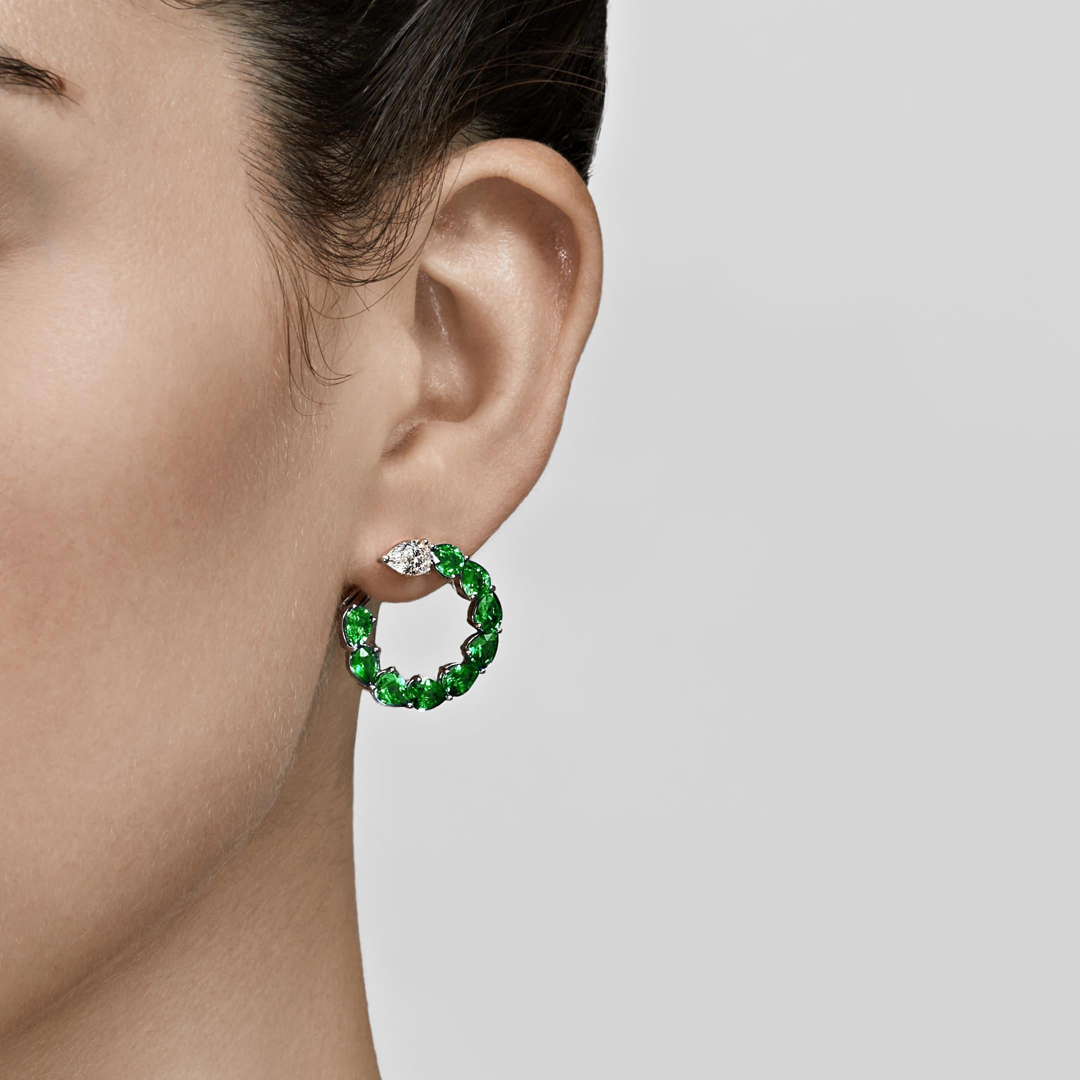 Hoop earrings are a fine jewelry necessity that works for so many occasions. Small huggie hoop lend polish to a humble errand run, while a large, luxurious pair becomes the focal point of your ensemble. These pear-shaped emerald and diamond hoop