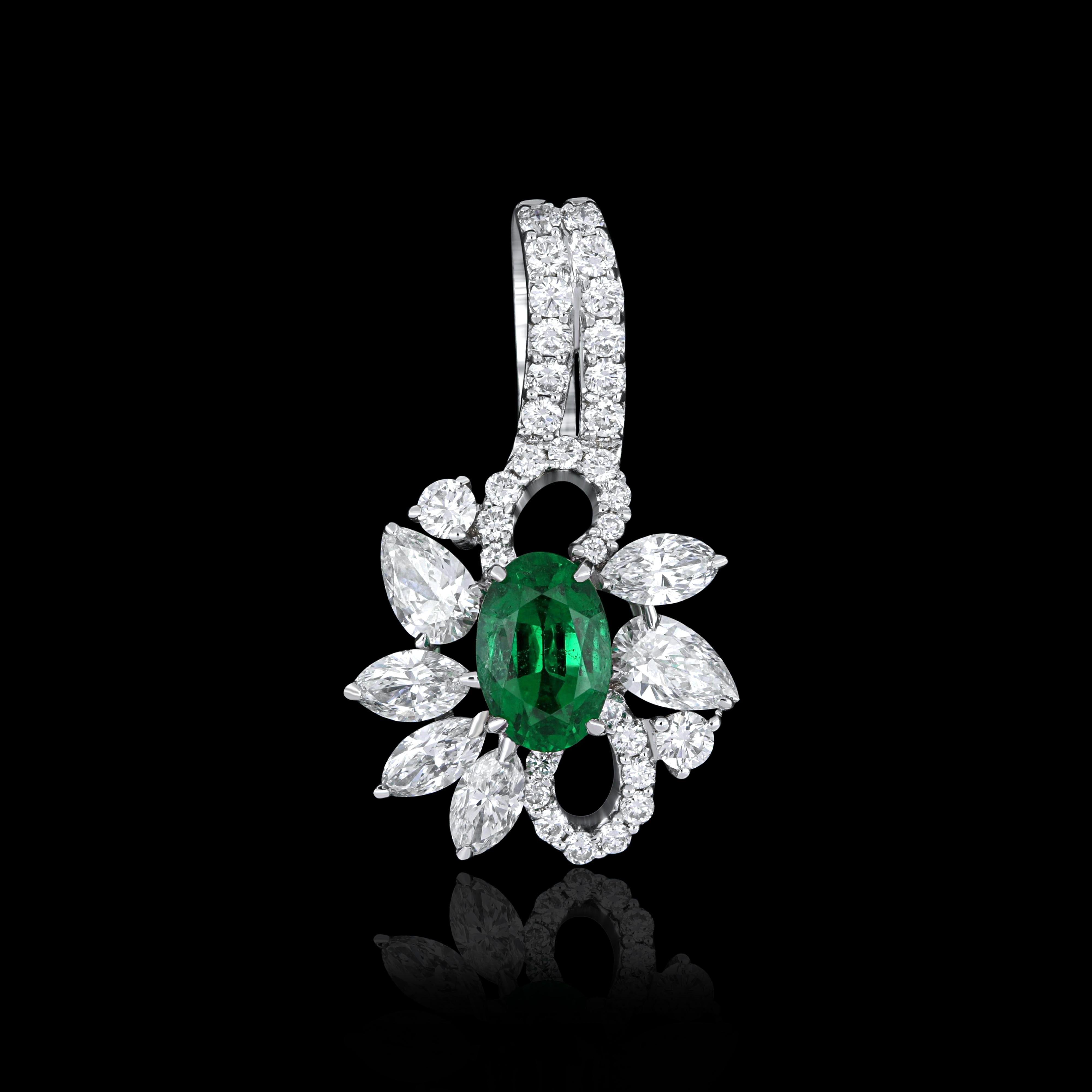Elegant and exquisitely detailed 18 Karat White Gold Pendant, center set with 0.45Cts .Oval Shape Emerald and micro pave set Diamonds, weighing approx. 0.70Cts Beautifully Hand crafted in 18 Karat White Gold. 

Stone Detail:
Emerald: 6x4MM

Stone