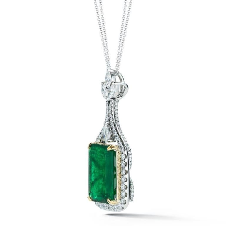 EMERALD AND DIAMOND PENDANT Surrounded by marquis, pear and round shaped diamonds in the front and back this Emerald really pops out in this 18k white gold setting Item: # 02364 Metal: 18k W / Y Lab: Gia Color Weight: 21.23 ct. Diamond Weight: 3.82