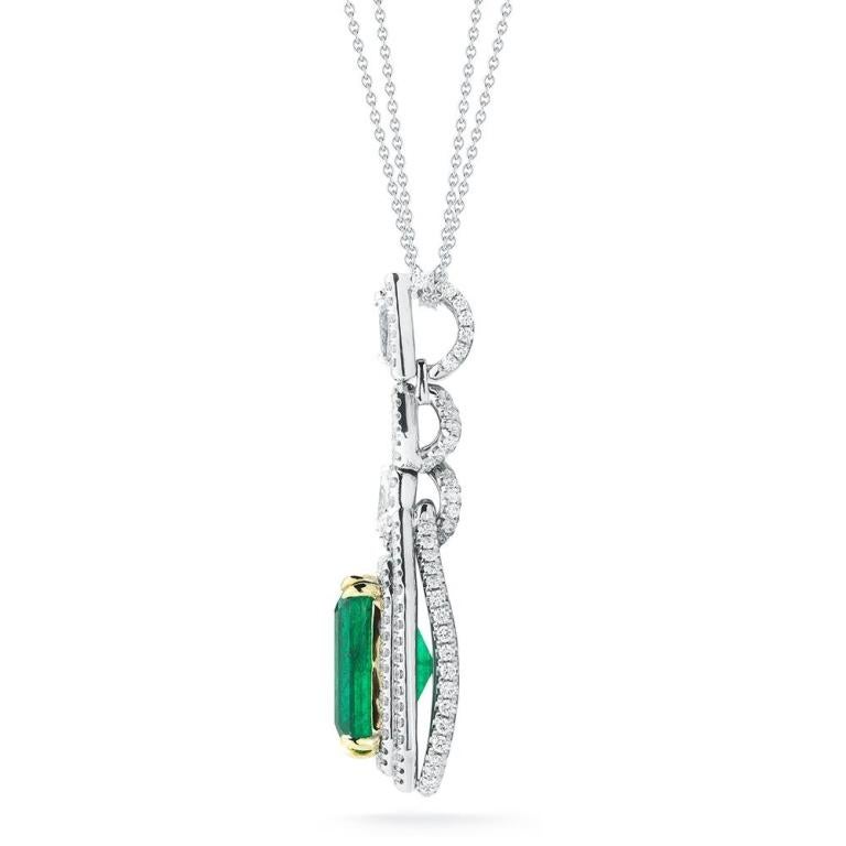 EMERALD AND DIAMOND PENDANT This beautiful necklace is adorned with diamonds on the front, it's back and on its sides. A marquis shaped diamond at the top and round pointers on the back and sides. Setting draws the eye right to the exquisite emerald