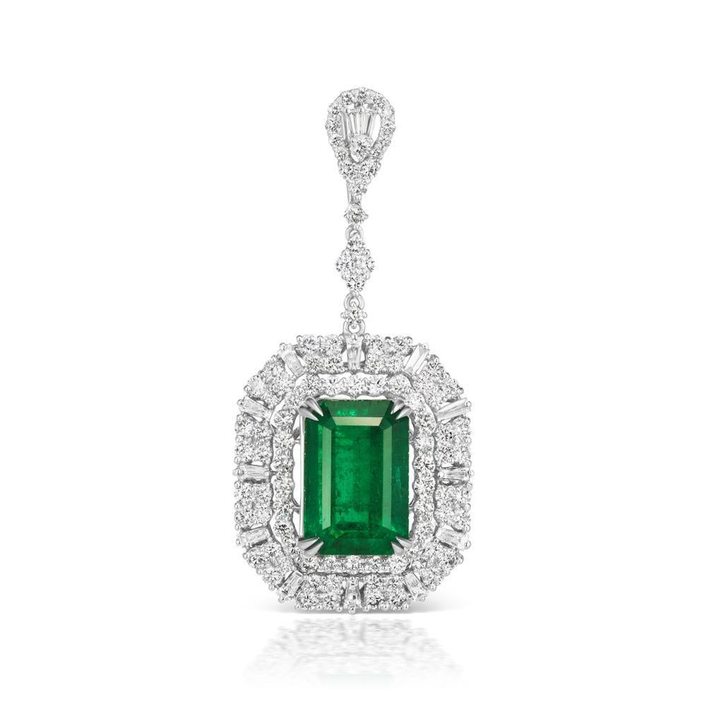 EMERALD AND DIAMOND PENDANT
A vibrant light colored Emerald shines in the center of this classic
pendant surrounded by double halo rows of polished diamonds
Item: # 03486
Metal: 18k W
Color Weight: 7.92 ct.
Diamond Weight: 2.44 ct.