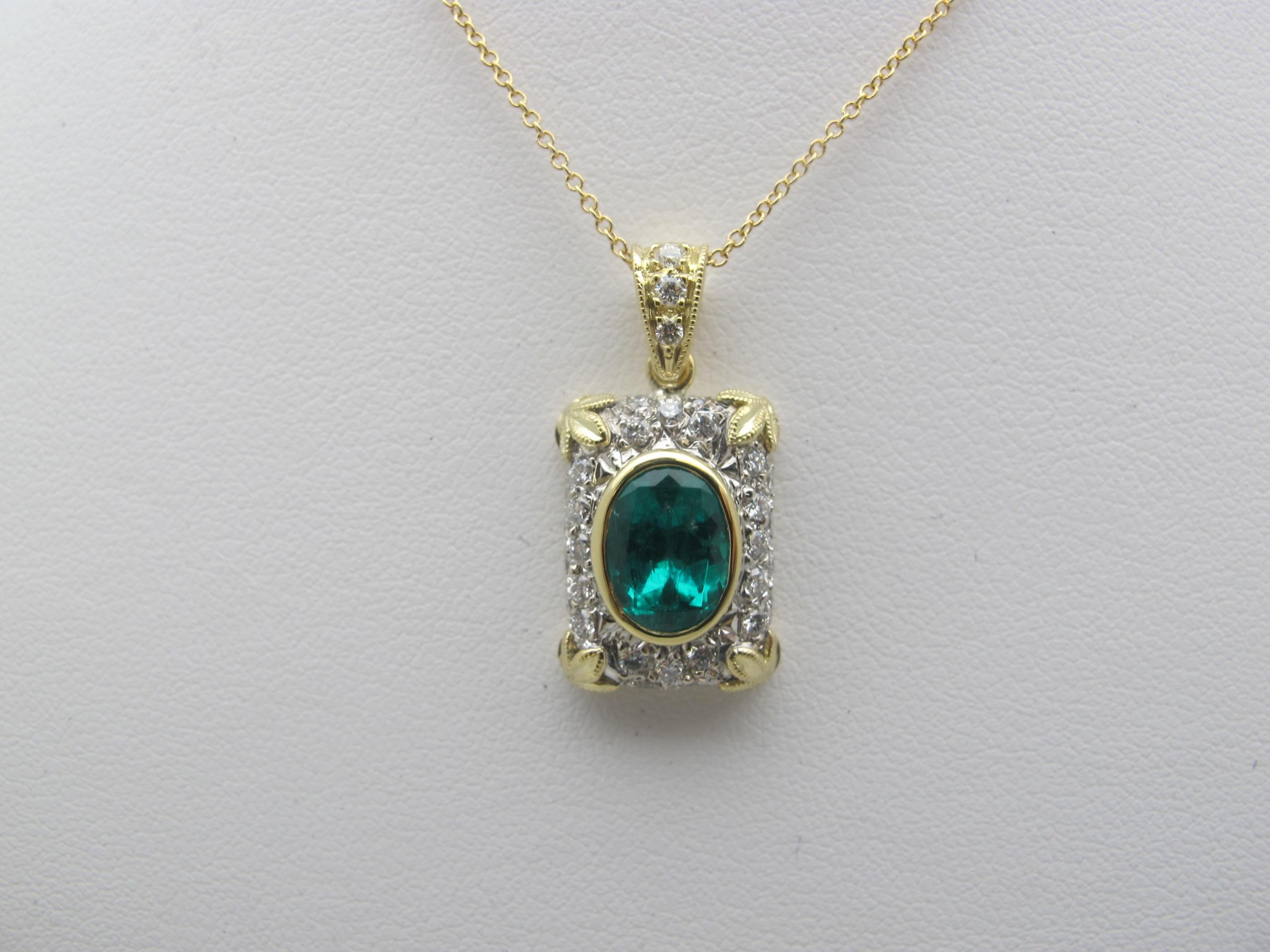 This beautiful pendant features a bright and sparkling oval emerald of mesmerizing color! Handmade in 18k yellow and white gold by our Master Jewelers in Los Angeles, this piece displays a superior level of craftsmanship and attention to detail that