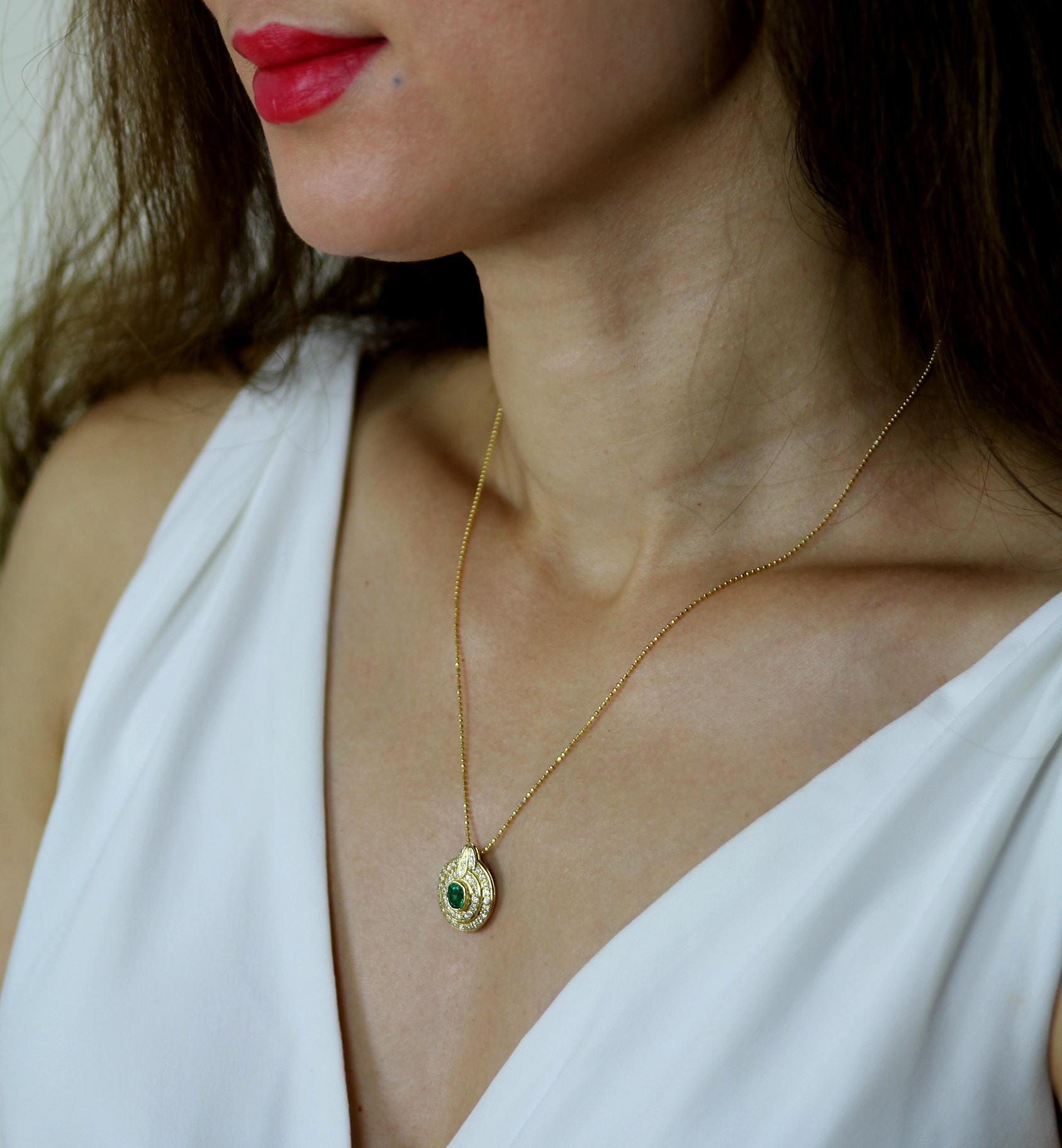 Modern Emerald and Diamond Oval Cluster Pendant in 18 Carat Yellow Gold