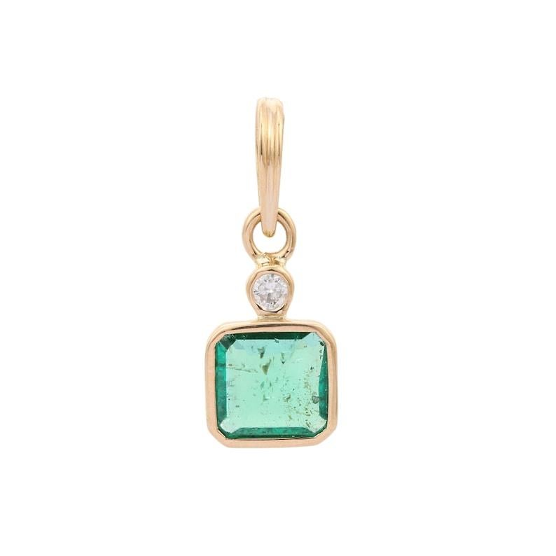 Emerald pendant in 18K Gold. It has a octagon cut emerald studded with diamond that completes your look with a decent touch. Pendants are used to wear or gifted to represent love and promises. It's an attractive jewelry piece that goes with every