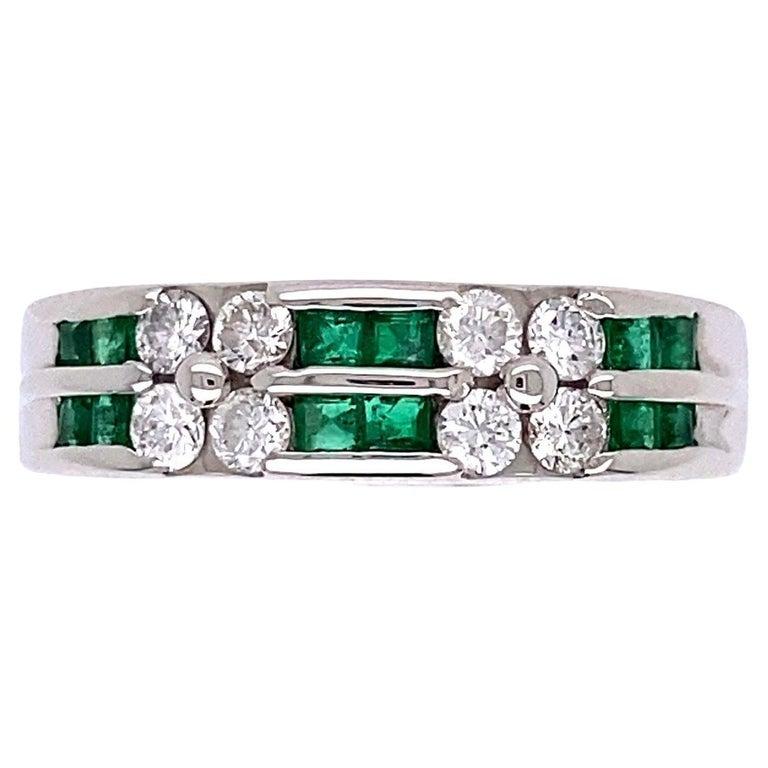 Simply Beautiful! Emerald and Diamond Platinum Cocktail Band Ring. Securely set with Calibrated Emeralds, weighing approx. 0.30tcw, inter-spaced with Diamonds, approx. 0.33tcw. Hand crafted in Platinum. Approx. dimensions: 0.81” l x 0.79” w x 0.20”