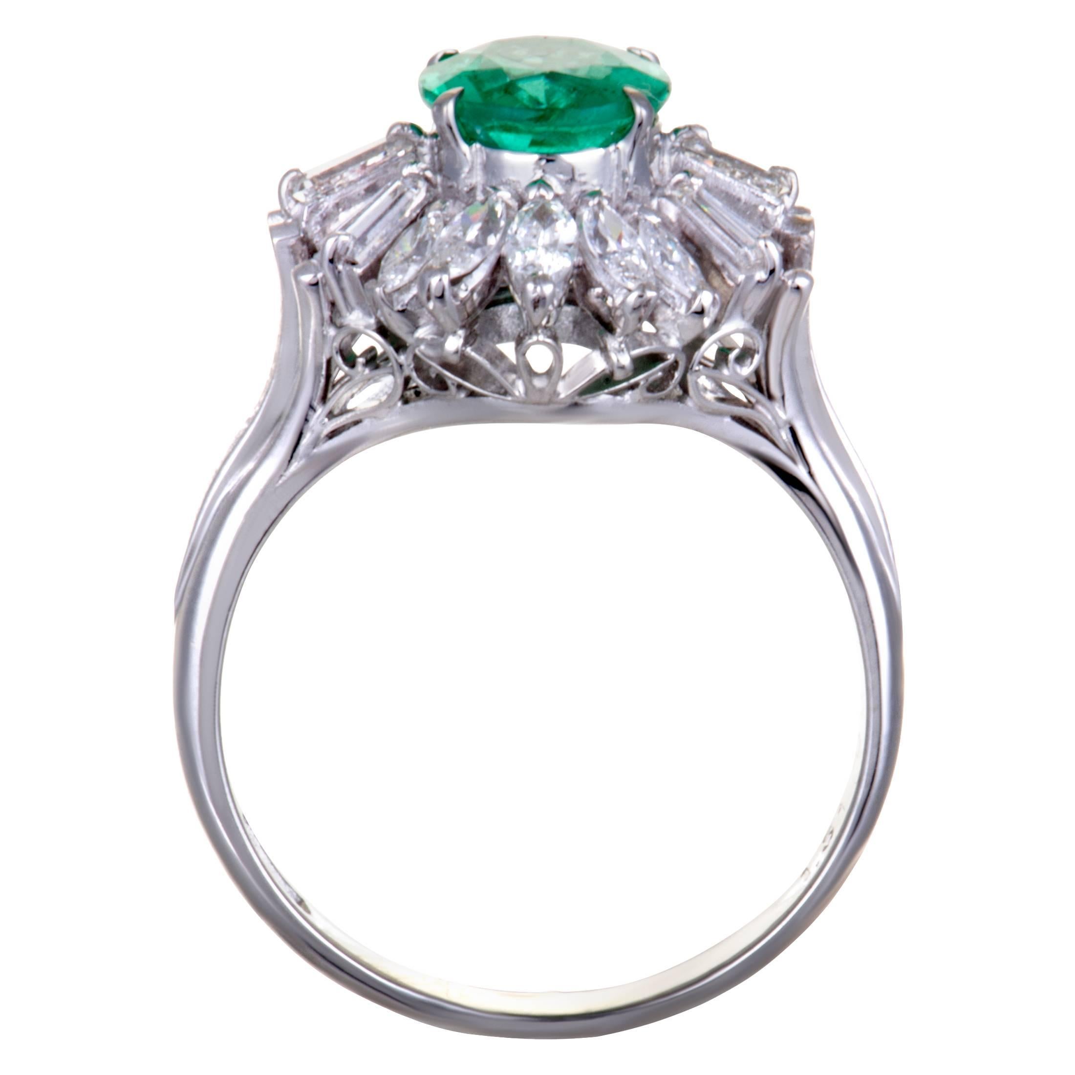 This attractive ring is an exquisite illustration of beauty! Stunningly designed in shimmering platinum, the stunning ring's design is embellished in scintillating diamonds, weighing 0.80ct and a a spectacular emerald weighing 1.51ct, that enhance