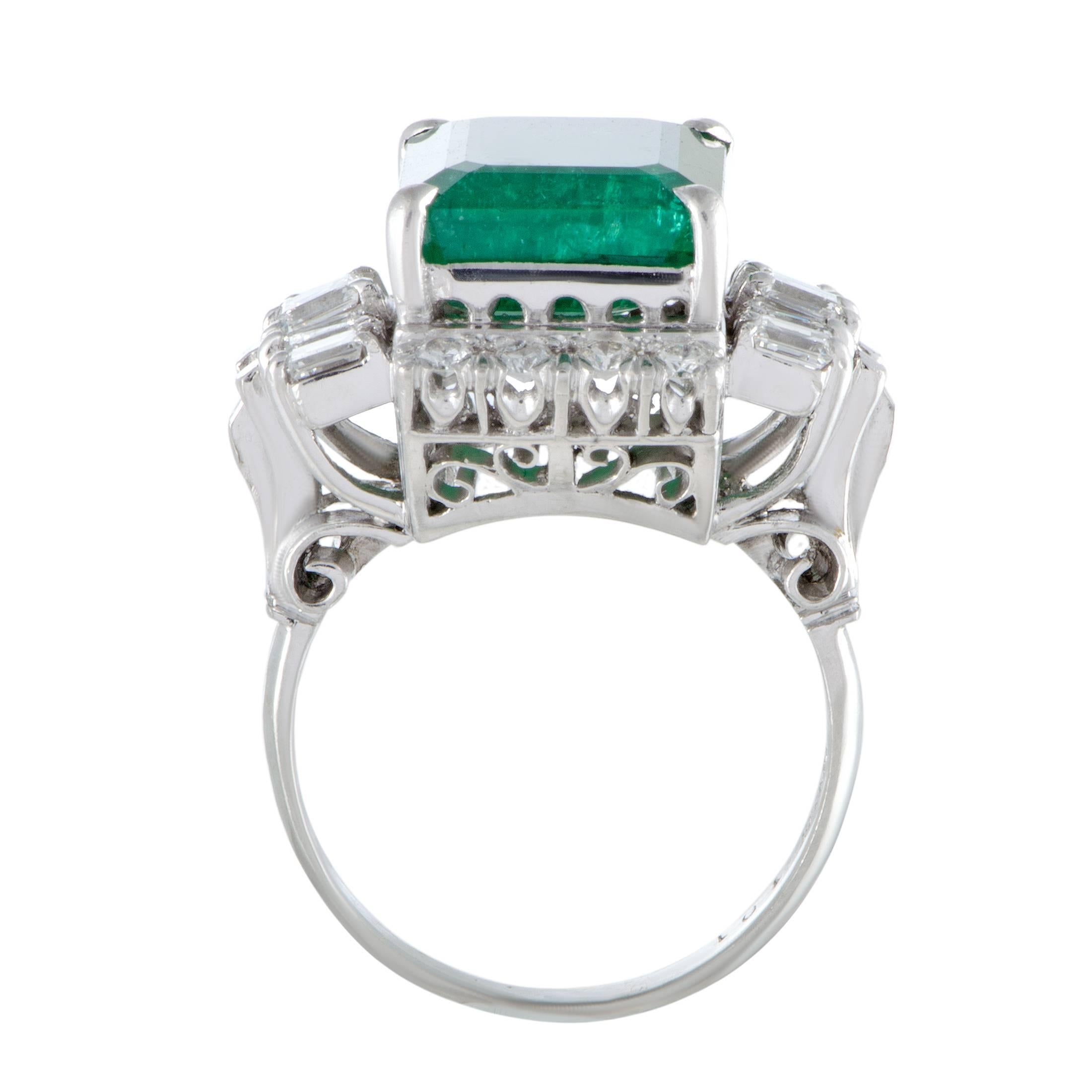 The exquisitely cut emerald is beautifully set against the luxuriously scintillating diamonds and the elegantly gleaming platinum in this superb ring that boasts an incredibly extravagant appeal. The emerald weighs 7.15 carats and it is accentuated