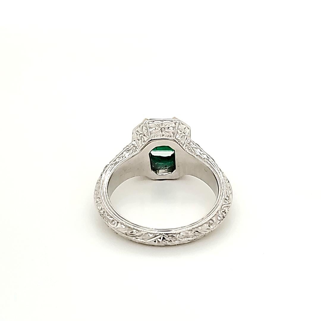 Contemporary Emerald and Diamond Platinum Engagement Ring For Sale