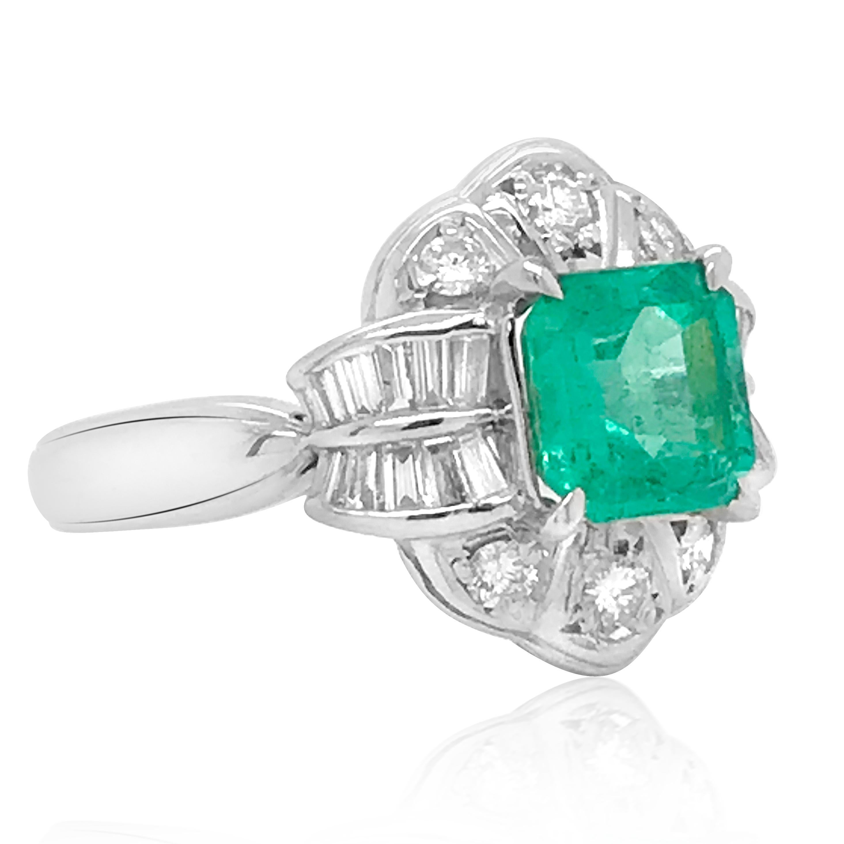 This alluring vintage emerald ring crafted is in solid platinum. Centering with an emerald of approx. 1.25 carats, enhanced by approx. 0.51ct diamonds, this impressive cocktail ring weighs 7.12 grams, measures in size 6.25 (adjustable) and remains