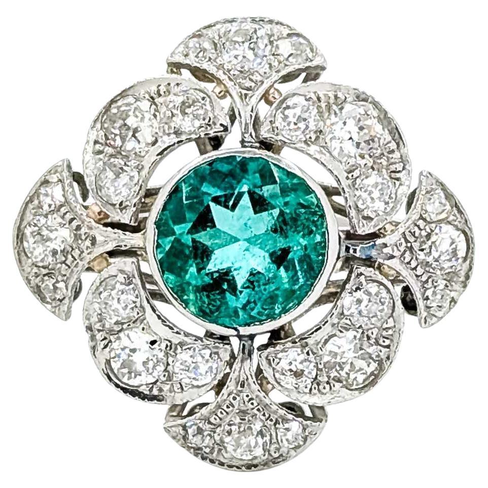 Anillo de platino con esmeralda y diamantes