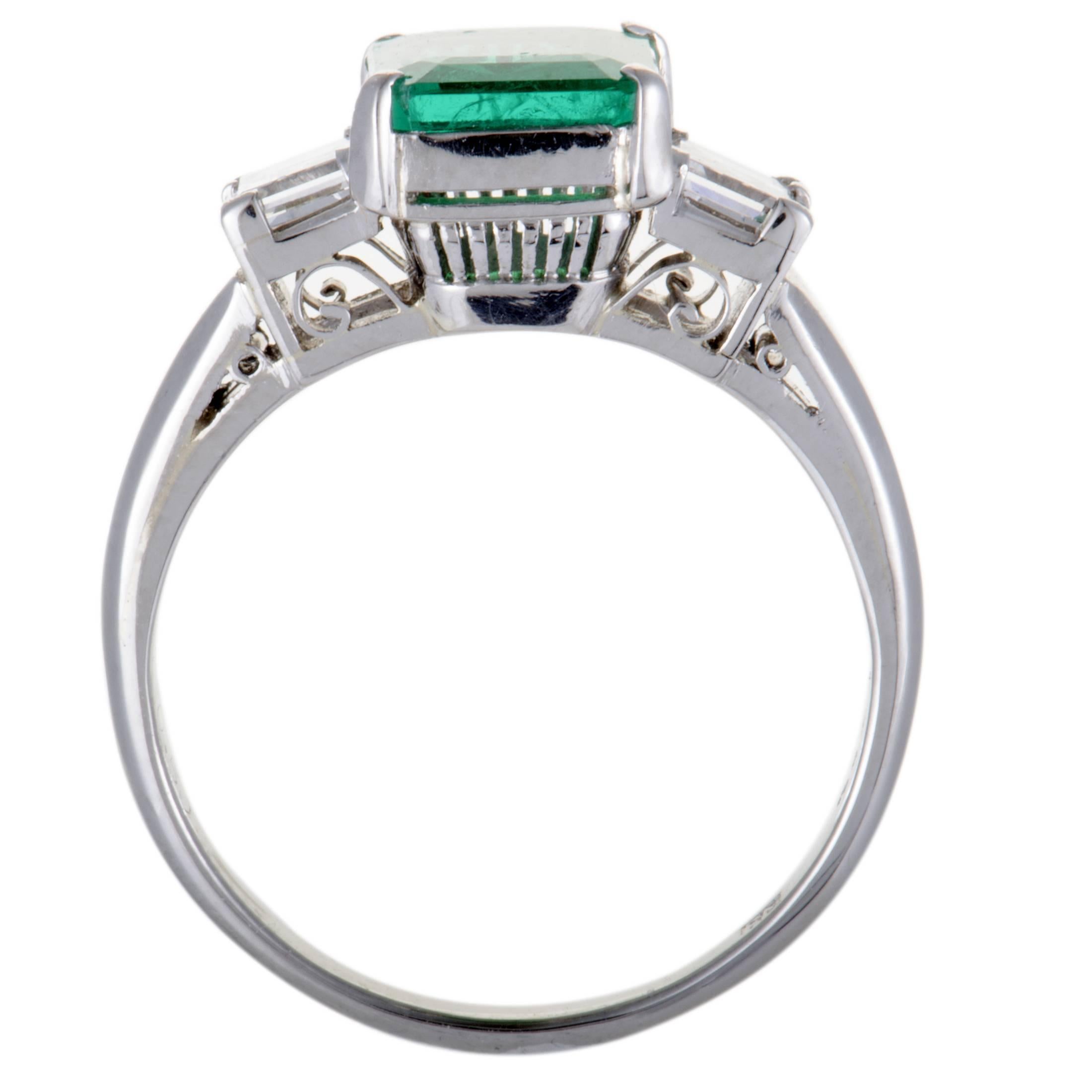 This mesmerizing ring features a classic design and compels with its luxurious décor. The fabulous ring is made of classy platinum and set with 0.50ct of sparkling diamonds around a captivating green emerald, weighing 1.40ct.
Ring Top Dimensions: