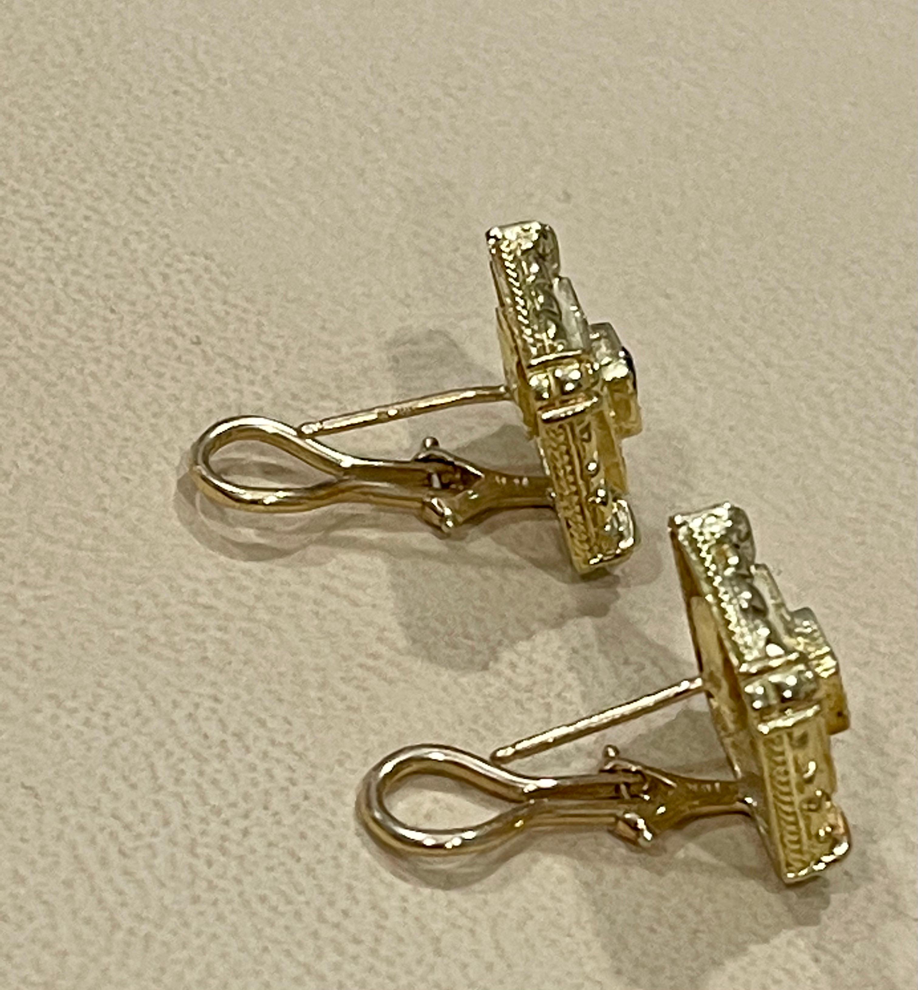 Round Cut Emerald and Diamond Post and Omega Back Earrings 18 Karat Yellow Gold For Sale