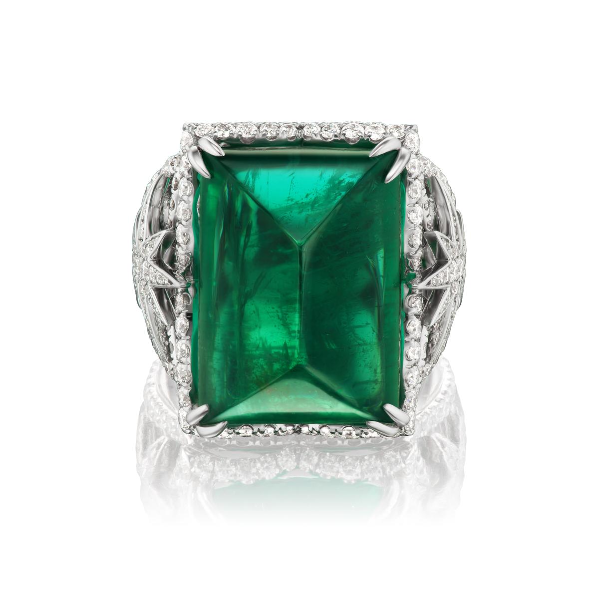 EMERALD AND DIAMOND RING
Takat's new collection displays this elegant Cabochon cut emerald with a classy star design for only the finest diamonds

Item:	# 04093
Metal:	18k White Gold
Color Weight:	23.36 ct.
Diamond Weight:	1.82 ct.