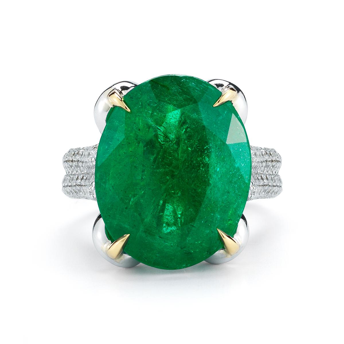 EMERALD AND DIAMOND RING
A romantic petal setting cradles a lovely oval Emerald.
Item:	# 01941
Metal:	18k W / Y
Lab:	GIA
Color Weight:	13.94 ct.
Diamond Weight:	1.98 ct.