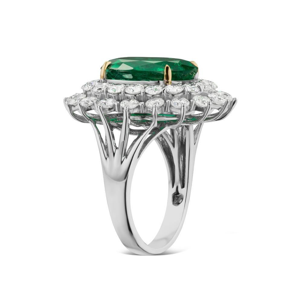 EMERALD AND DIAMOND RING 
A rich oval emerald sits with round shaped diamonds in a substantial white gold setting.

Item:	# 02418
Setting:	18K W
Color Weight:	5.27 ct. of Emerald
Diamond Weight:	2.83 ct. of Diamonds