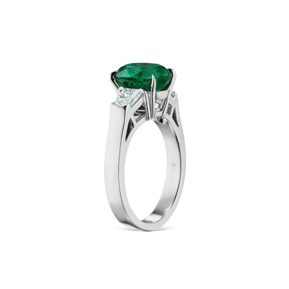 EMERALD AND DIAMOND RING
timeless styling of extraordinary Emerald flanked by two bright fancy shape diamonds. A piece to be handed down through generations.
Item:	# 03508
Setting:	18K W
Lab:	C.Dunaigre
Color Weight:	2.45 ct. of Emerald
Diamond
