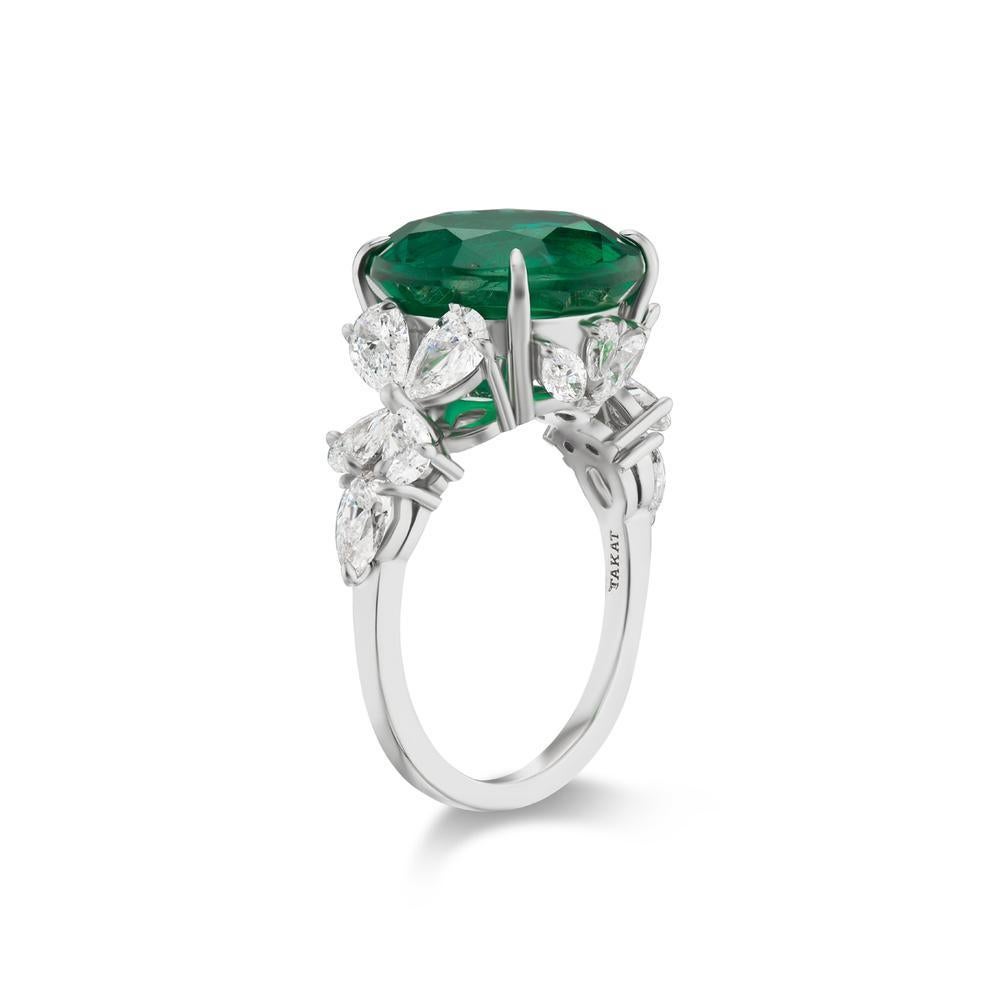 ZAMBIAN EMERALD AND DIAMOND RING BY TAKAT
Pear & Marquis shape diamond leaves reminiscent of the Garden of Eden surround a lush Round shape Emerald.
Item:	# 03819
Setting:	Platinum
Color Weight:	7.18 ct. of Emerald
Diamond Weight:	2.12 ct. of